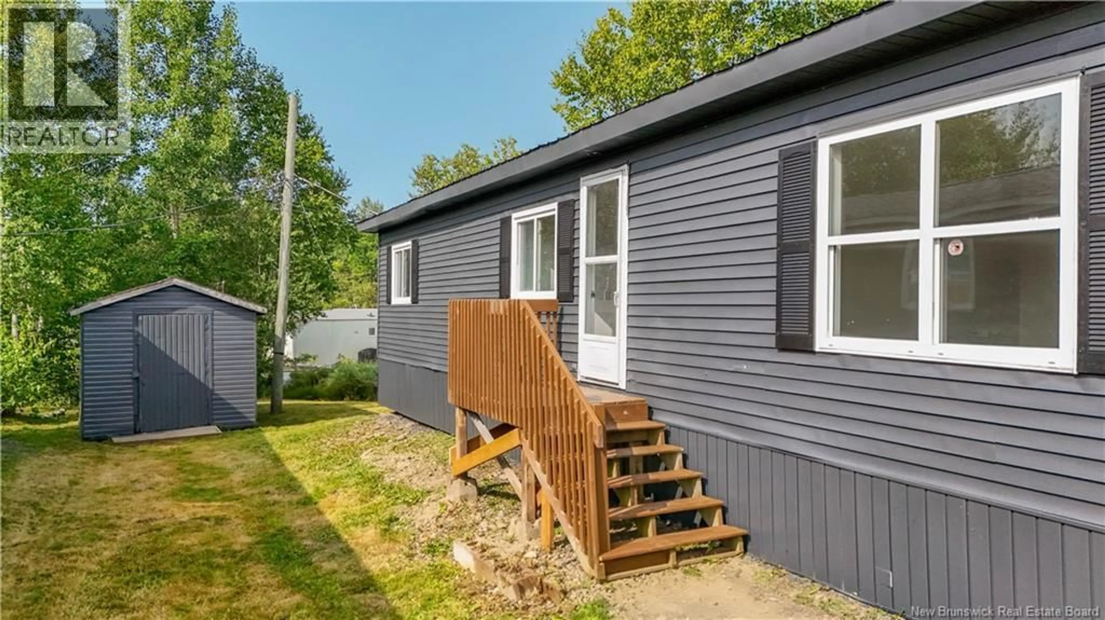 Home with vinyl exterior material, street for 63 NORTHWOOD STREET, Hanwell New Brunswick E3B6R3