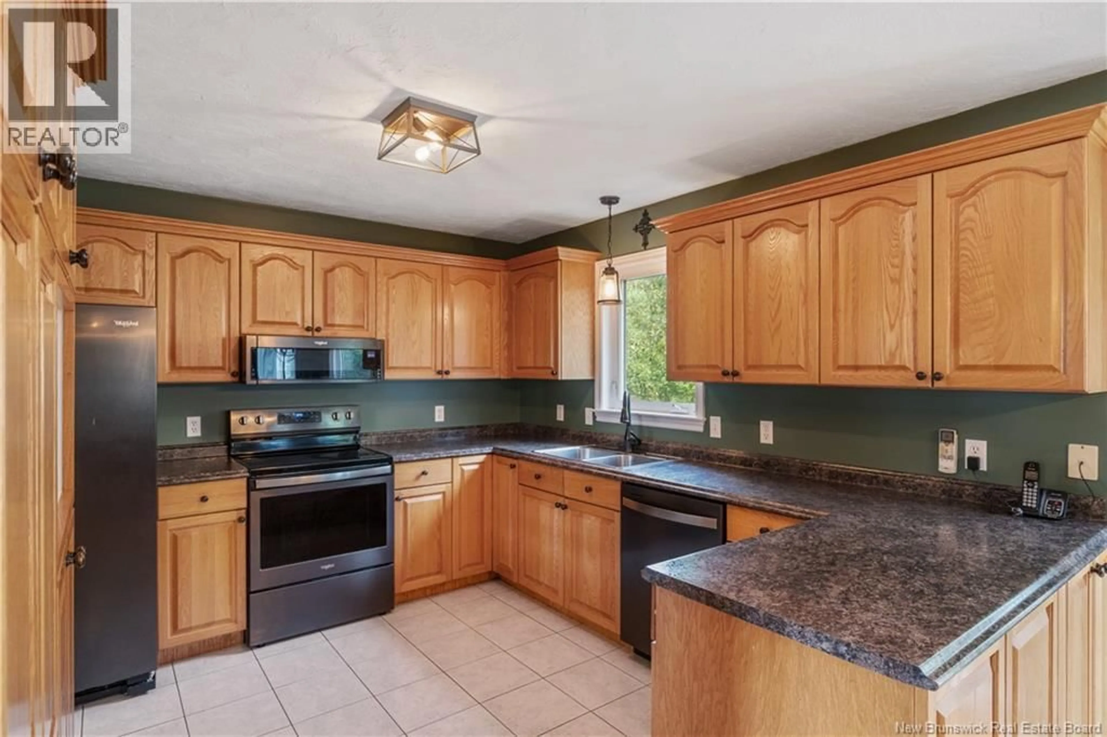 Open concept kitchen, ceramic/tile floor for 524 ALPHEE, Dieppe New Brunswick E1A6W6