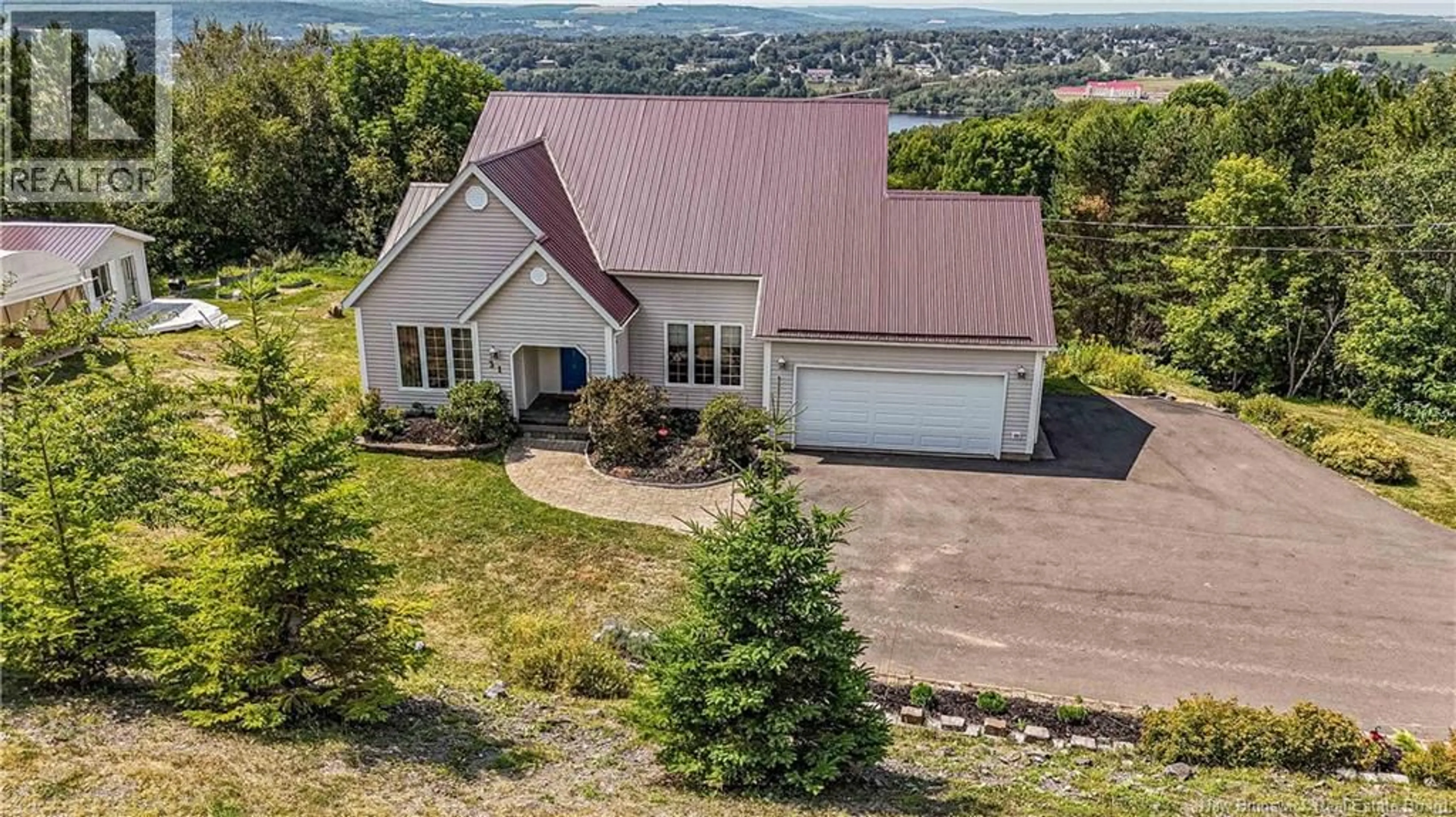 A pic from outside/outdoor area/front of a property/back of a property/a pic from drone, mountain view for 31 ROSEWOOD DRIVE, Woodstock New Brunswick E7N1P4