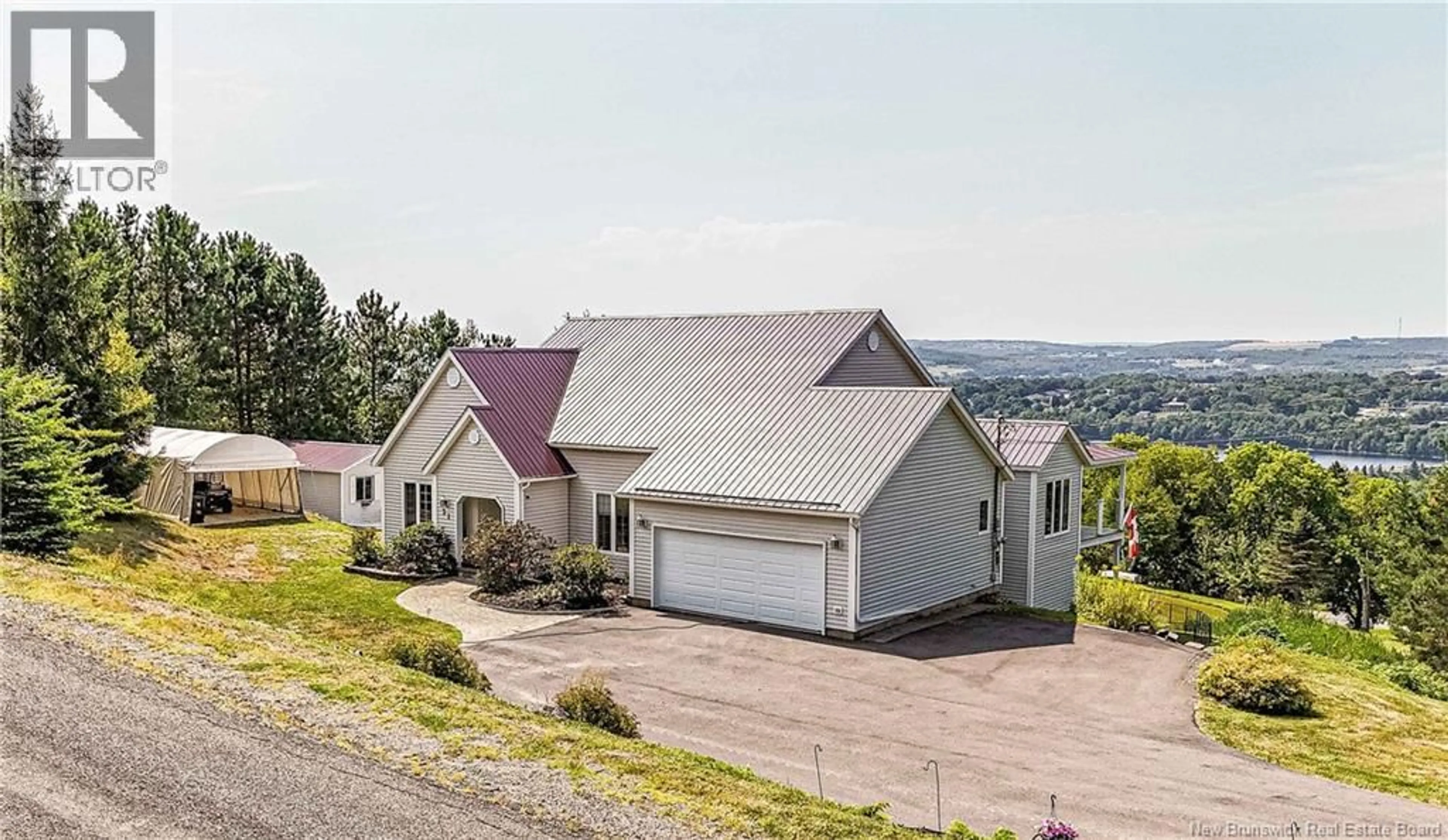 A pic from outside/outdoor area/front of a property/back of a property/a pic from drone, mountain view for 31 ROSEWOOD DRIVE, Woodstock New Brunswick E7N1P4