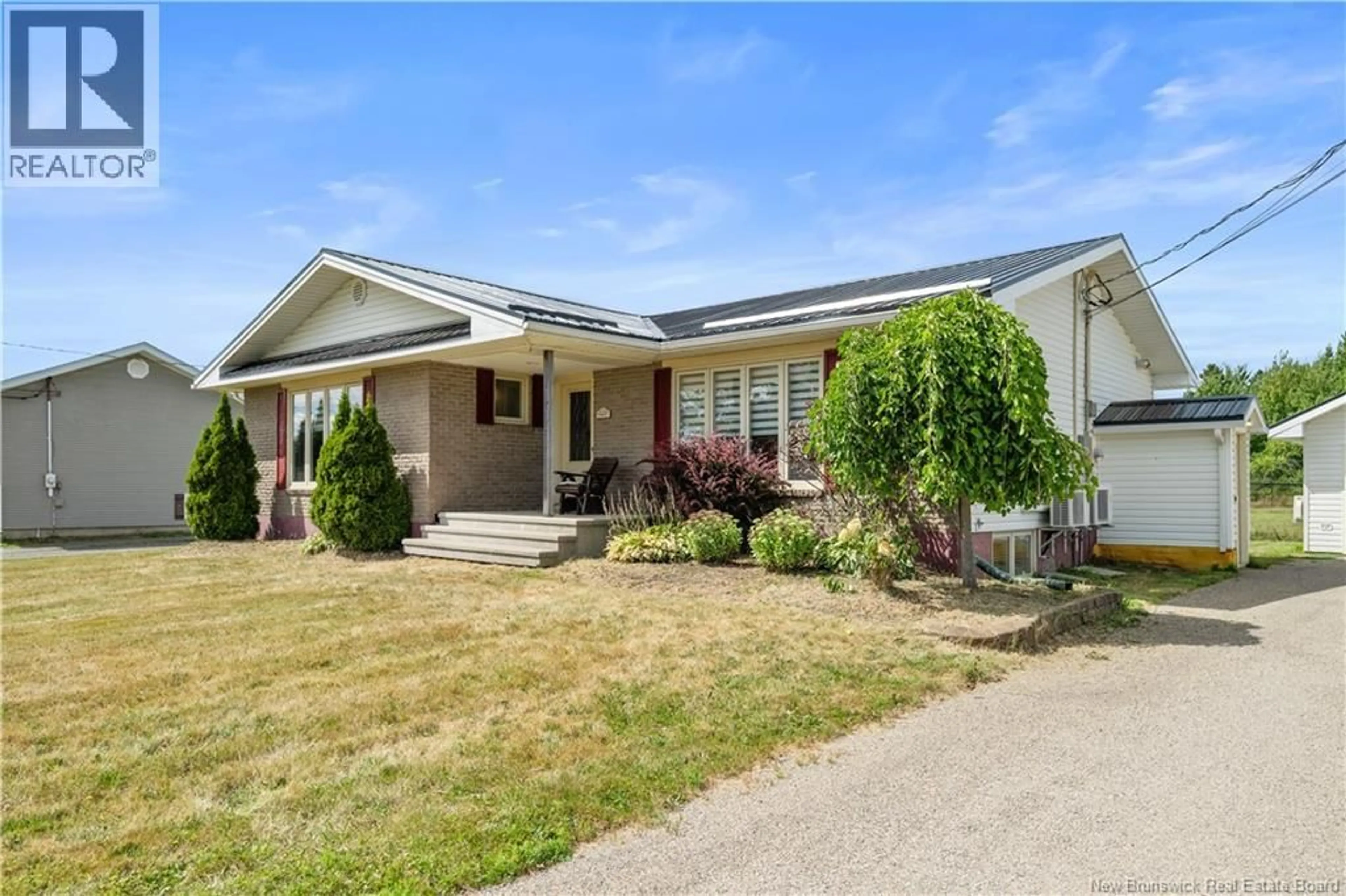 Home with vinyl exterior material, street for 227 IRVING BOULEVARD, Bouctouche New Brunswick E4S3K5