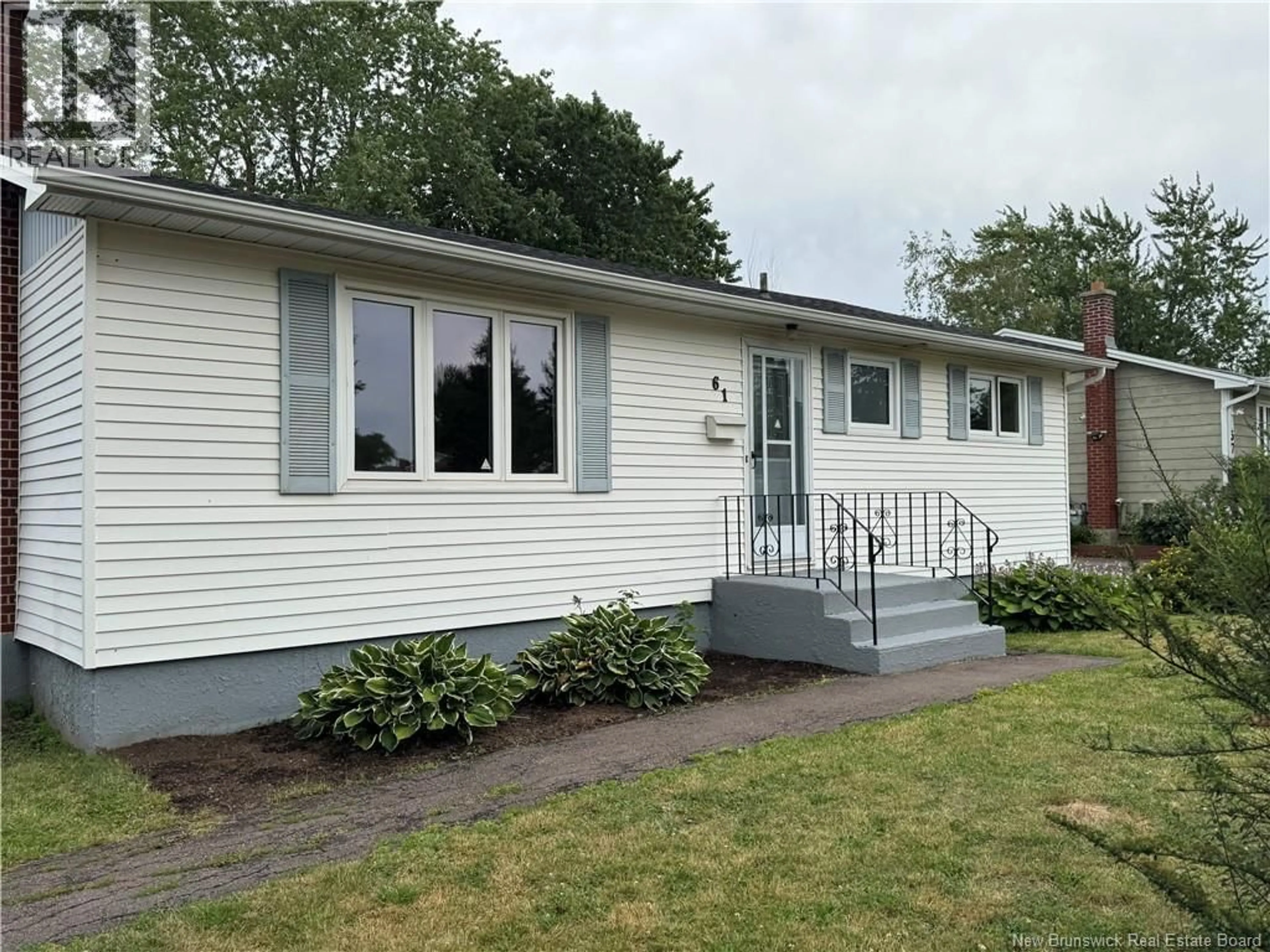 Home with vinyl exterior material, street for 61 ROYAL ROAD, Moncton New Brunswick E1A4S8
