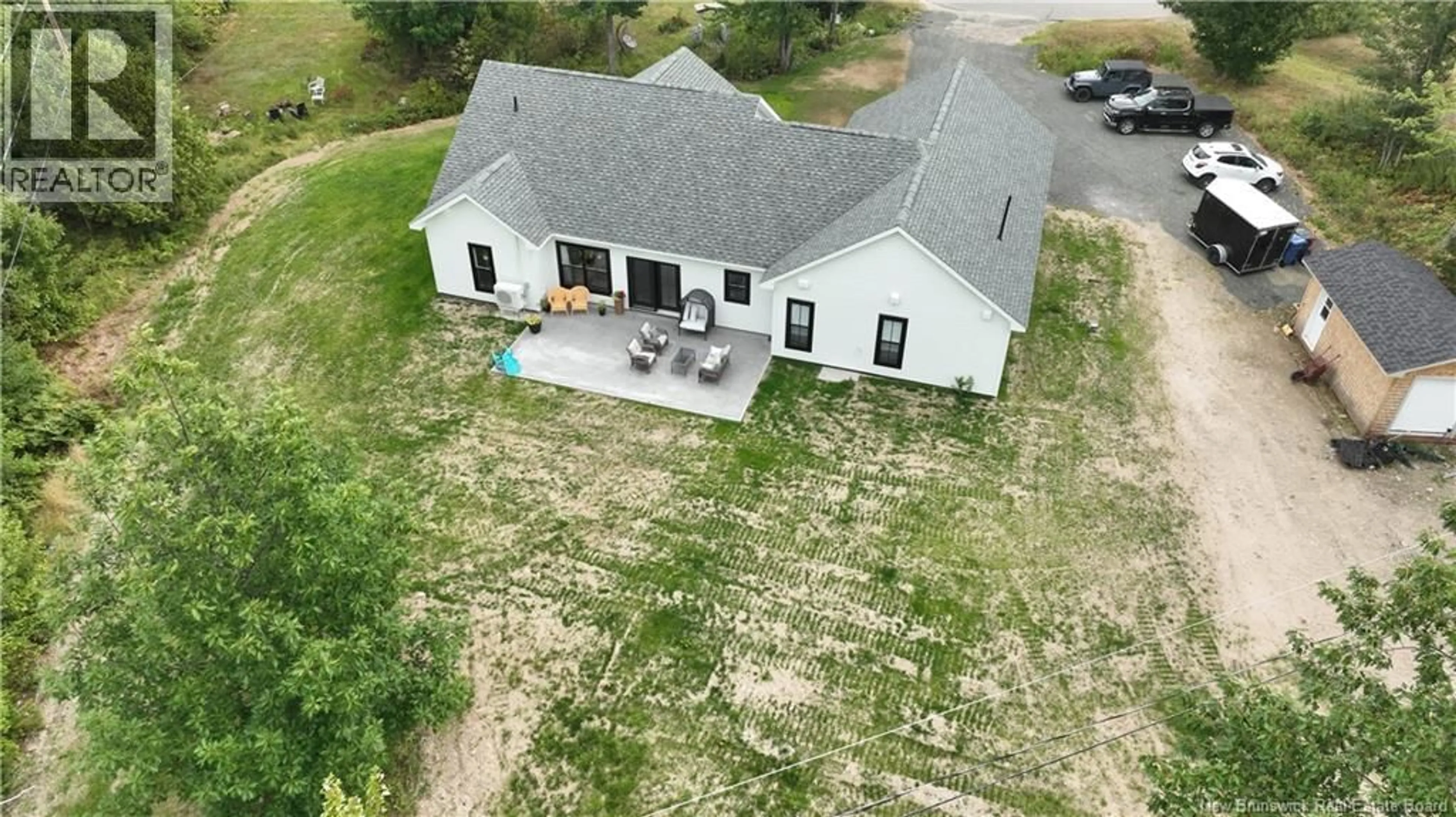 A pic from outside/outdoor area/front of a property/back of a property/a pic from drone, building for 4 RIVERVIEW AVE, Miramichi New Brunswick E1N3J9
