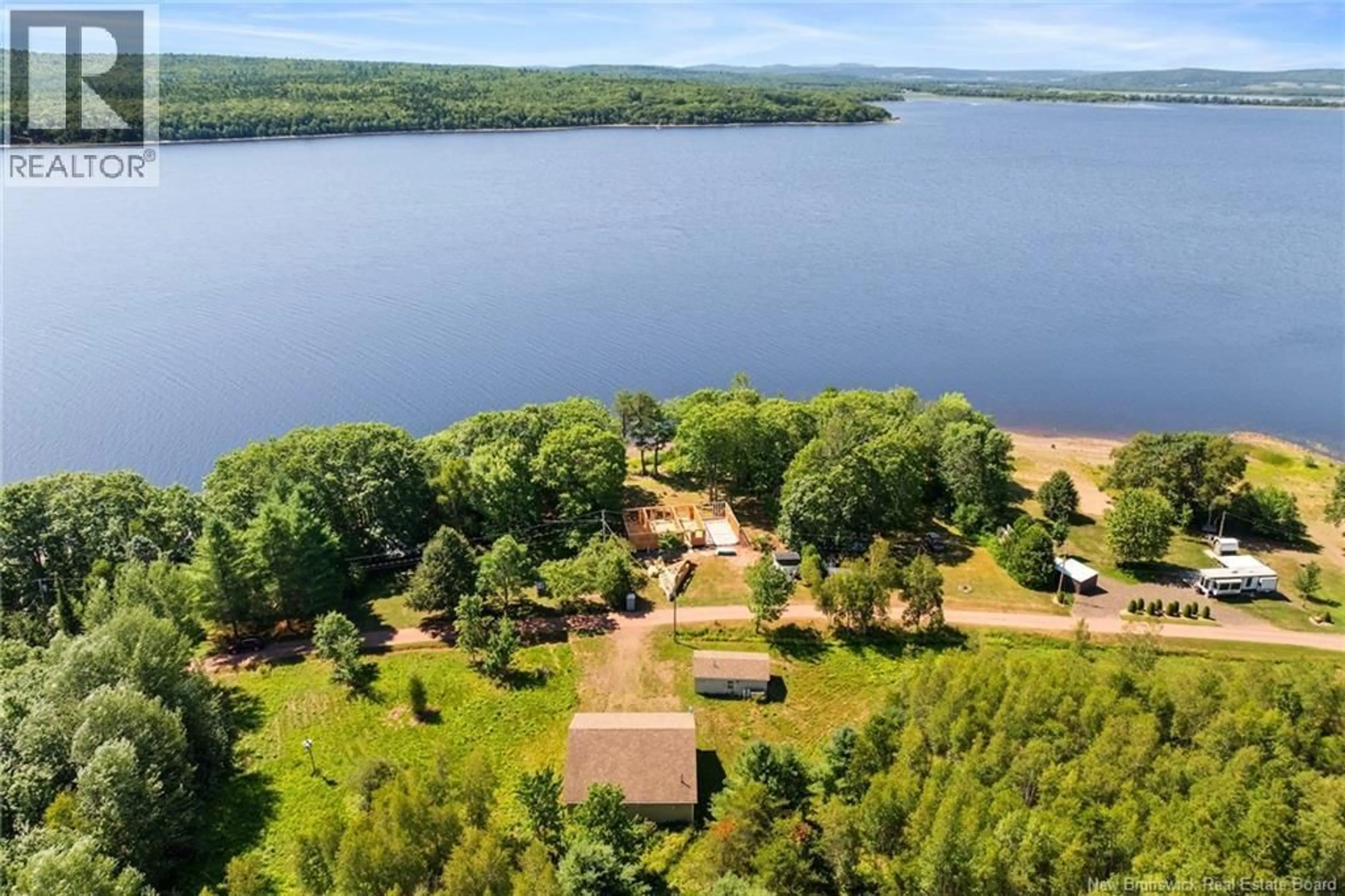 A pic from outside/outdoor area/front of a property/back of a property/a pic from drone, water/lake/river/ocean view for 34 WASHADEMOAK LANE, Cambridge-Narrows New Brunswick E4C4G7