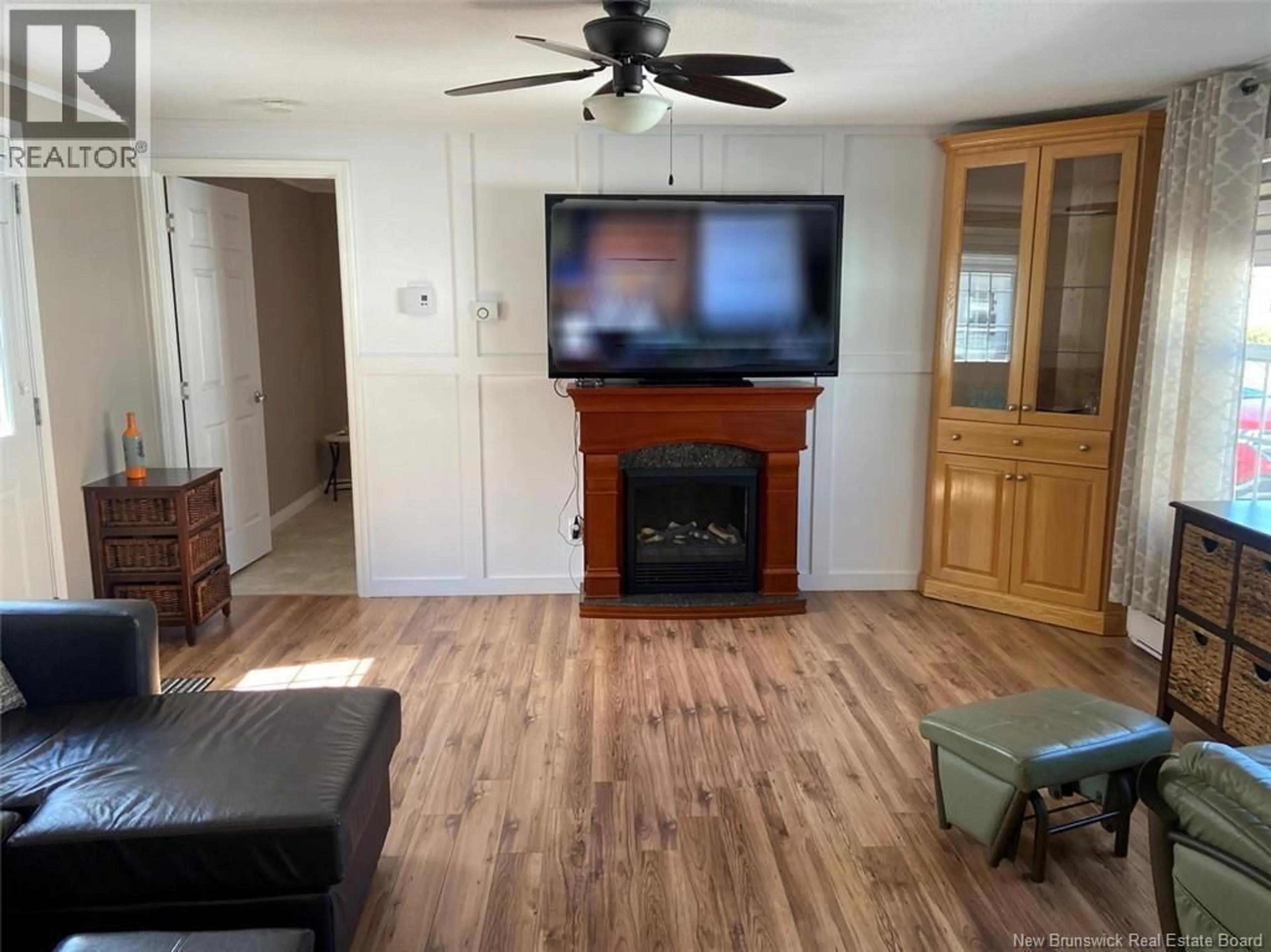 Living room with furniture, wood/laminate floor for 45 ALBERT ROAD, Saint-Jacques New Brunswick E7B1Z6