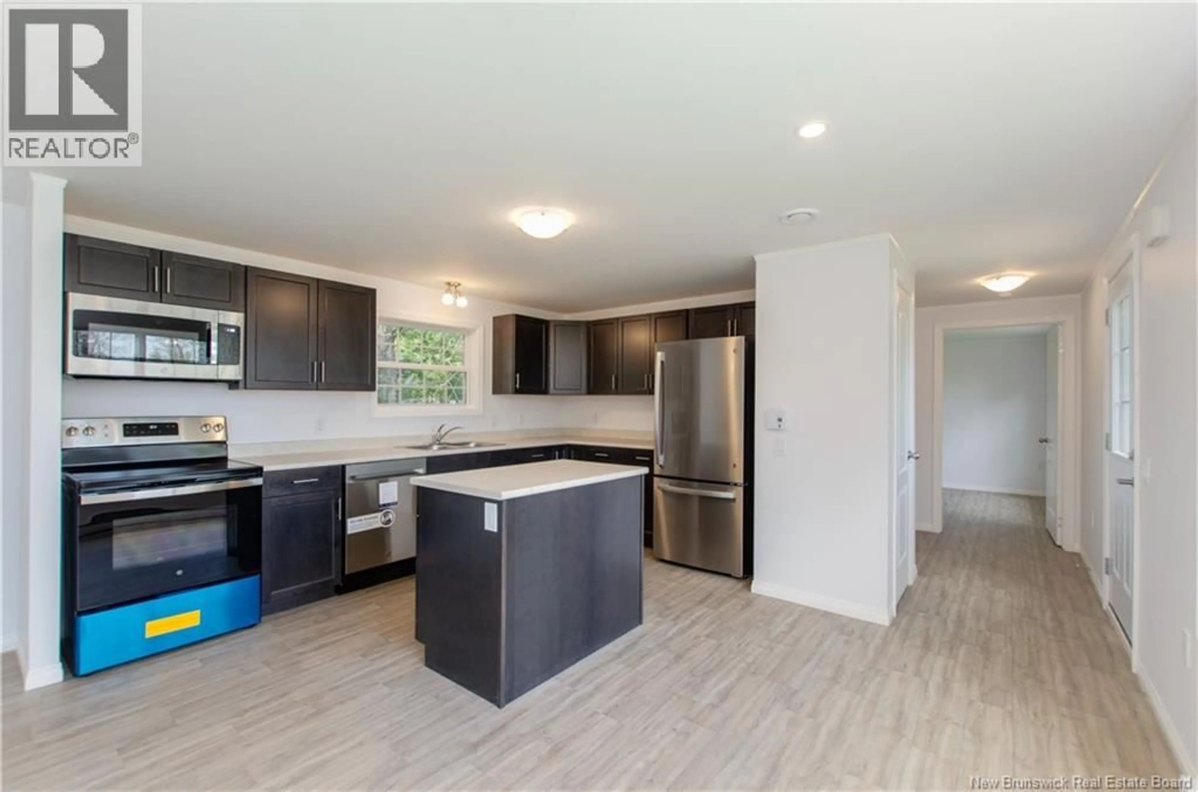 Open concept kitchen, wood/laminate floor for 11 WILLOWGROVE STREET, Moncton New Brunswick E1H3C2