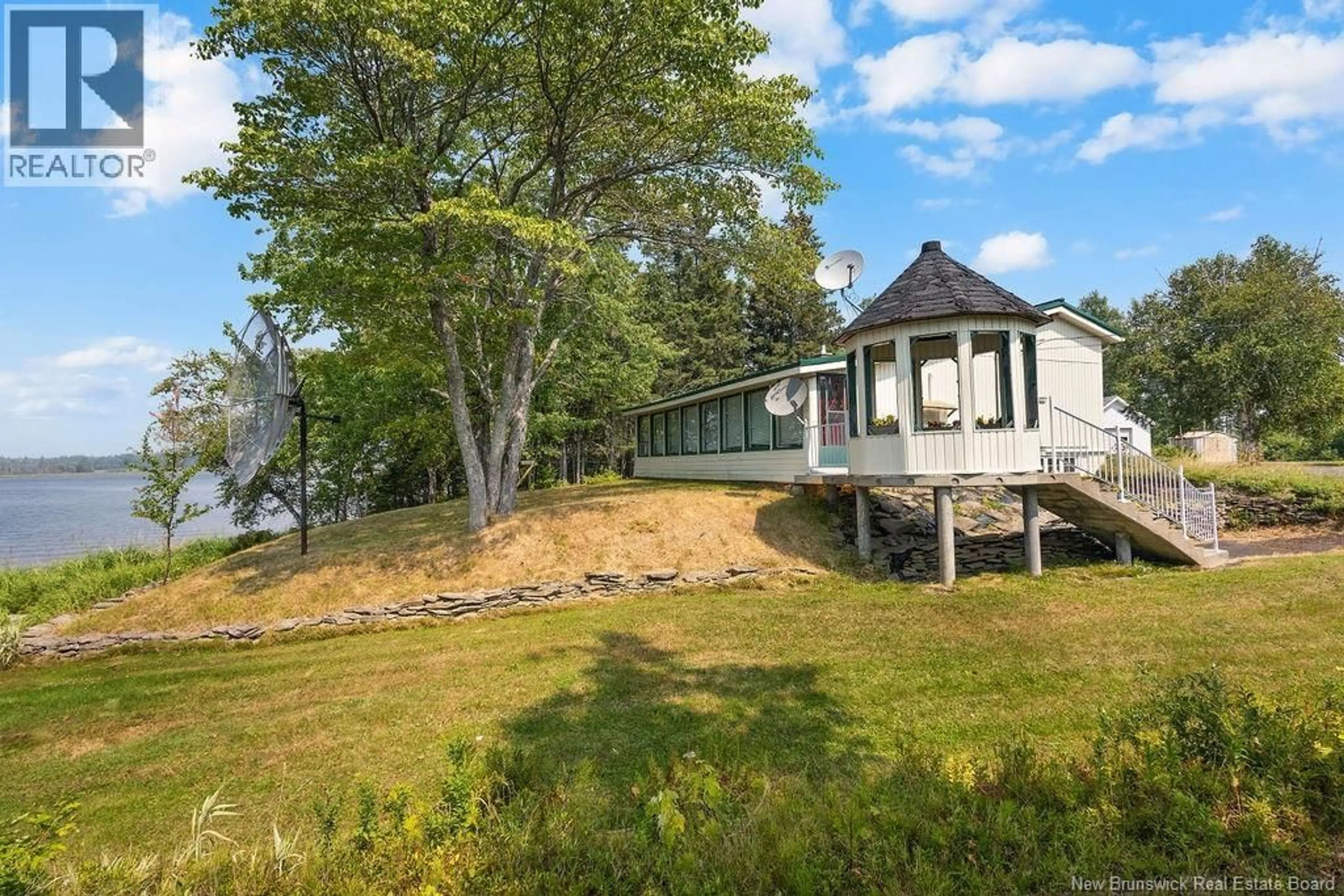 A pic from outside/outdoor area/front of a property/back of a property/a pic from drone, water/lake/river/ocean view for 117 COMEAU POINT ROAD, Pokemouche New Brunswick E8P1E9