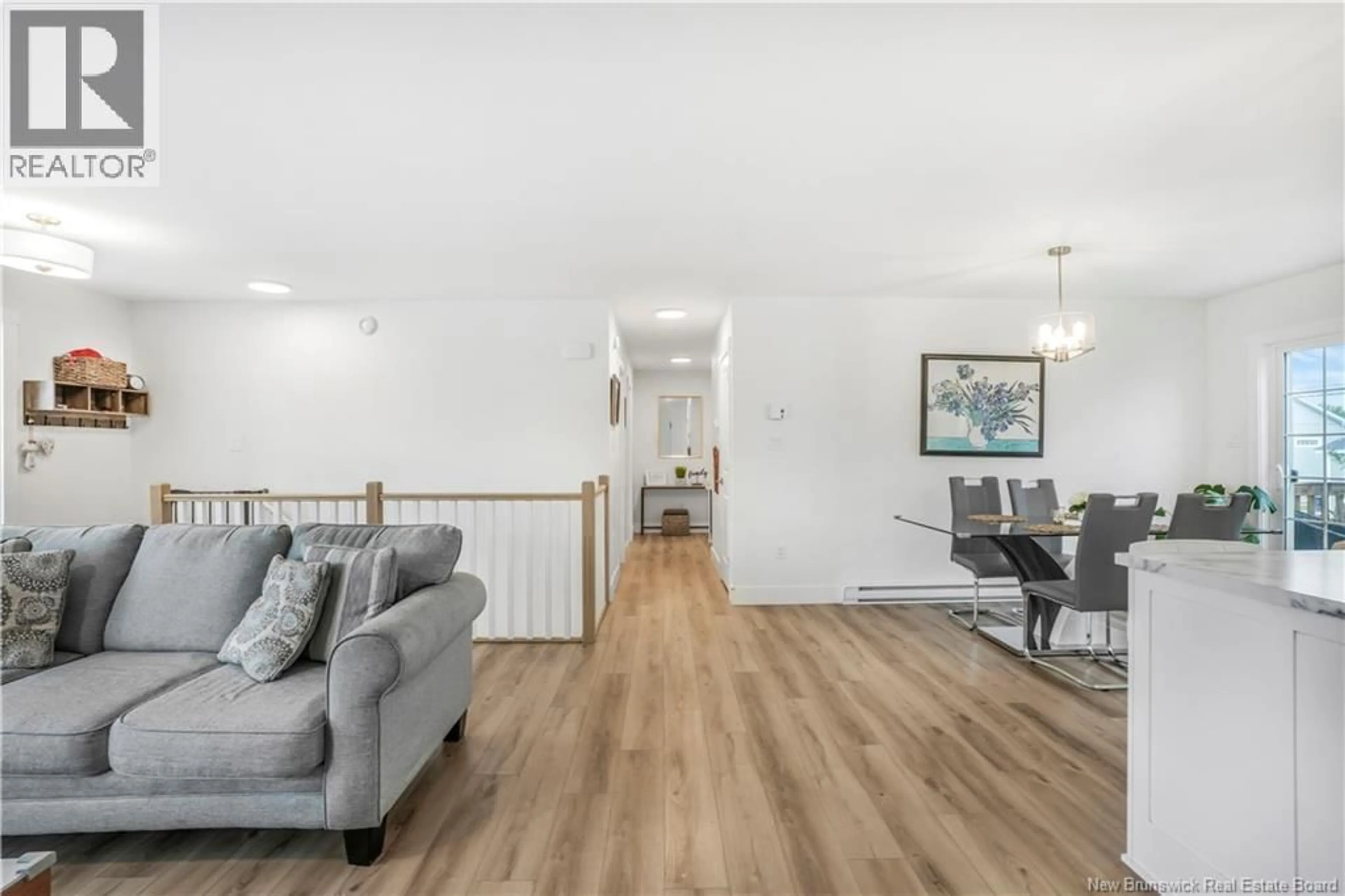 Living room with furniture, wood/laminate floor for 27 AIDEN STREET, Fredericton New Brunswick E3G0E3
