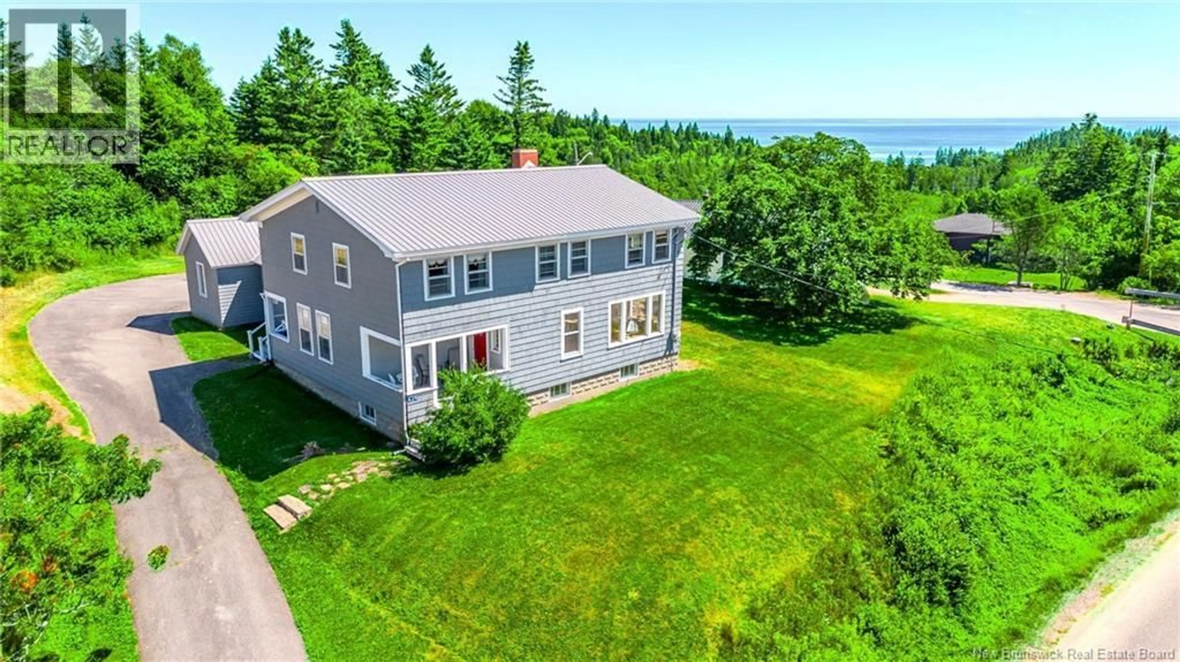A pic from outside/outdoor area/front of a property/back of a property/a pic from drone, water/lake/river/ocean view for 639 MAIN STREET, Beaver Harbour New Brunswick E5H1N8