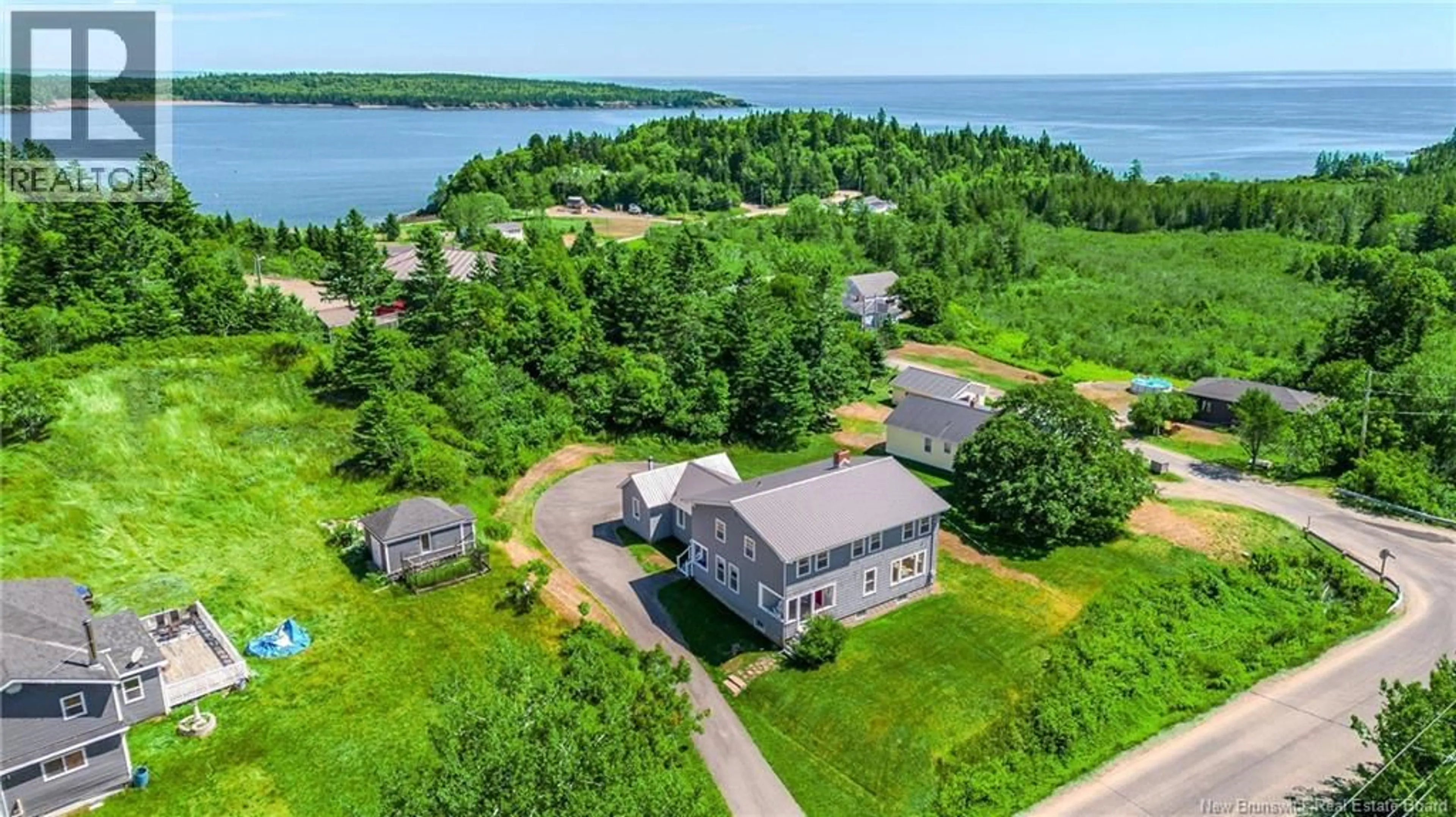 A pic from outside/outdoor area/front of a property/back of a property/a pic from drone, water/lake/river/ocean view for 639 MAIN STREET, Beaver Harbour New Brunswick E5H1N8