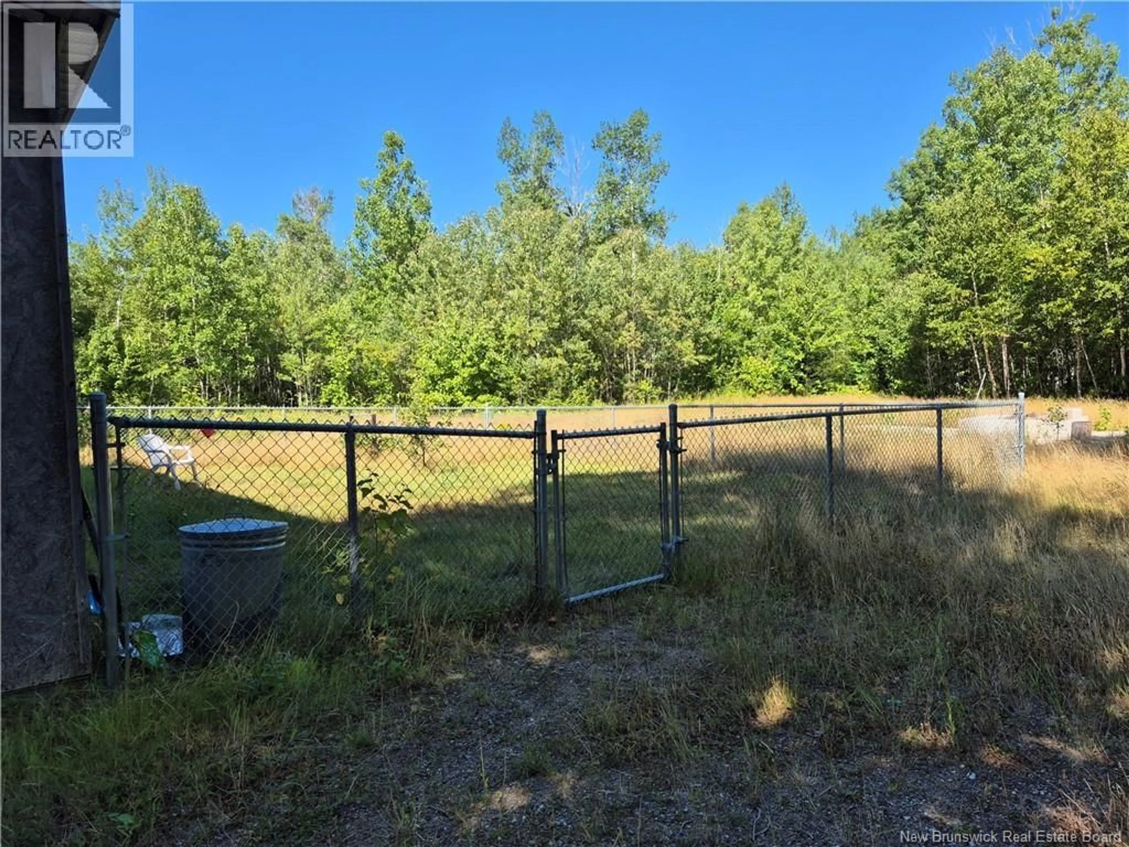 A pic from outside/outdoor area/front of a property/back of a property/a pic from drone, forest/trees view for 815 RTE 303, Village-Des-Poirier New Brunswick E8N1N2