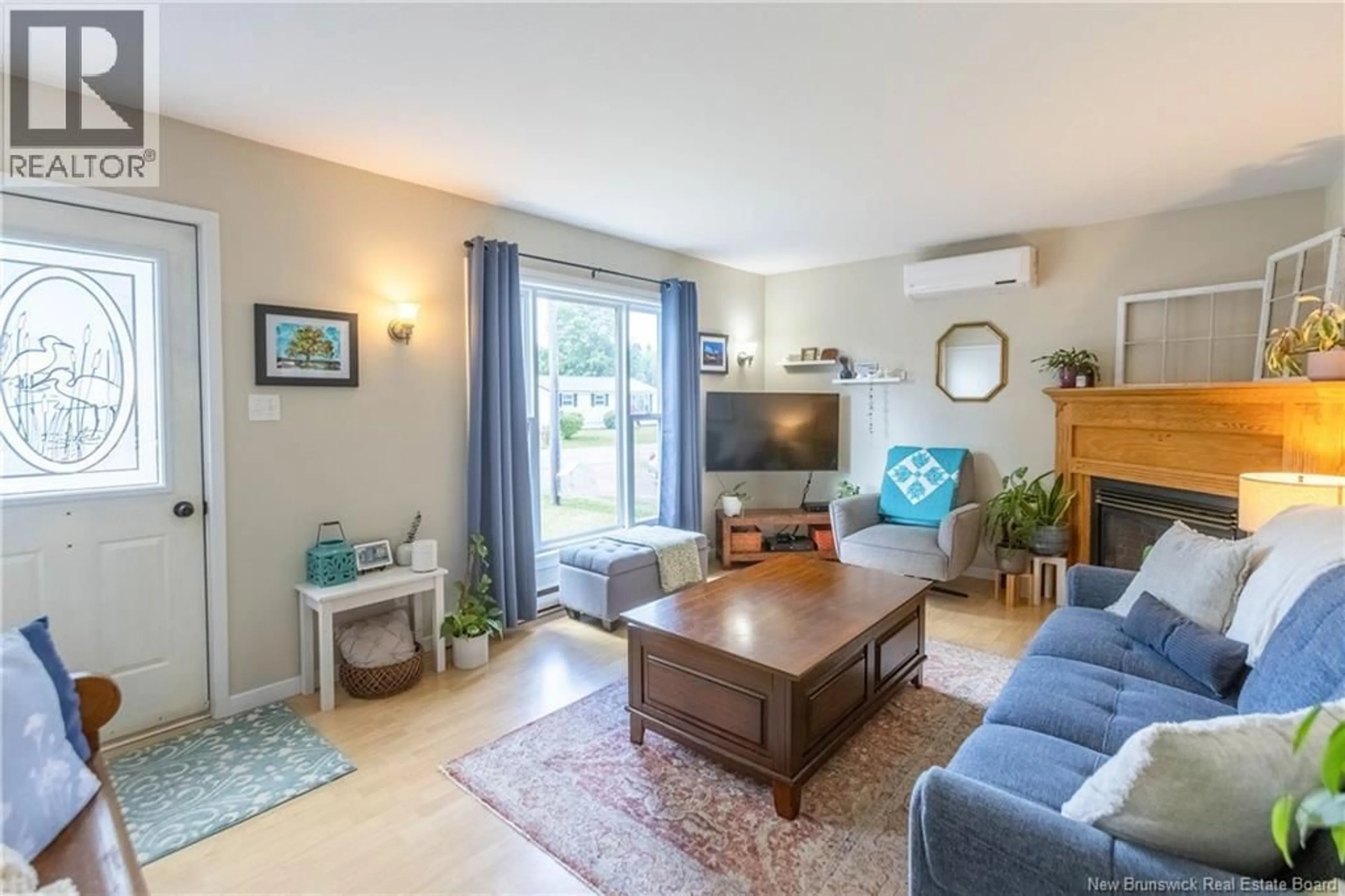 Living room with furniture, wood/laminate floor for 39 CHURCHILL AVENUE, Sackville New Brunswick E4L3T3