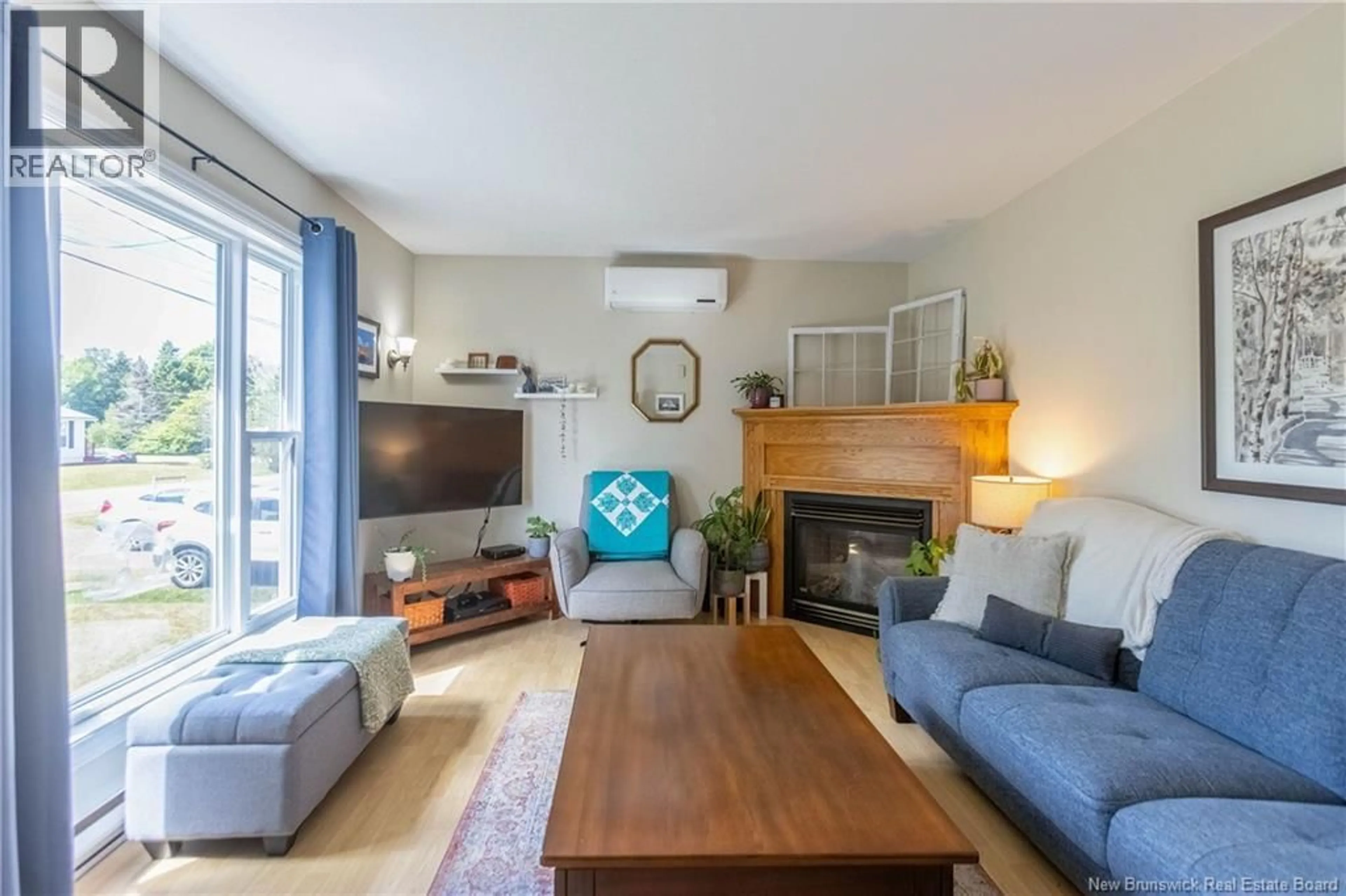 Living room with furniture, wood/laminate floor for 39 CHURCHILL AVENUE, Sackville New Brunswick E4L3T3