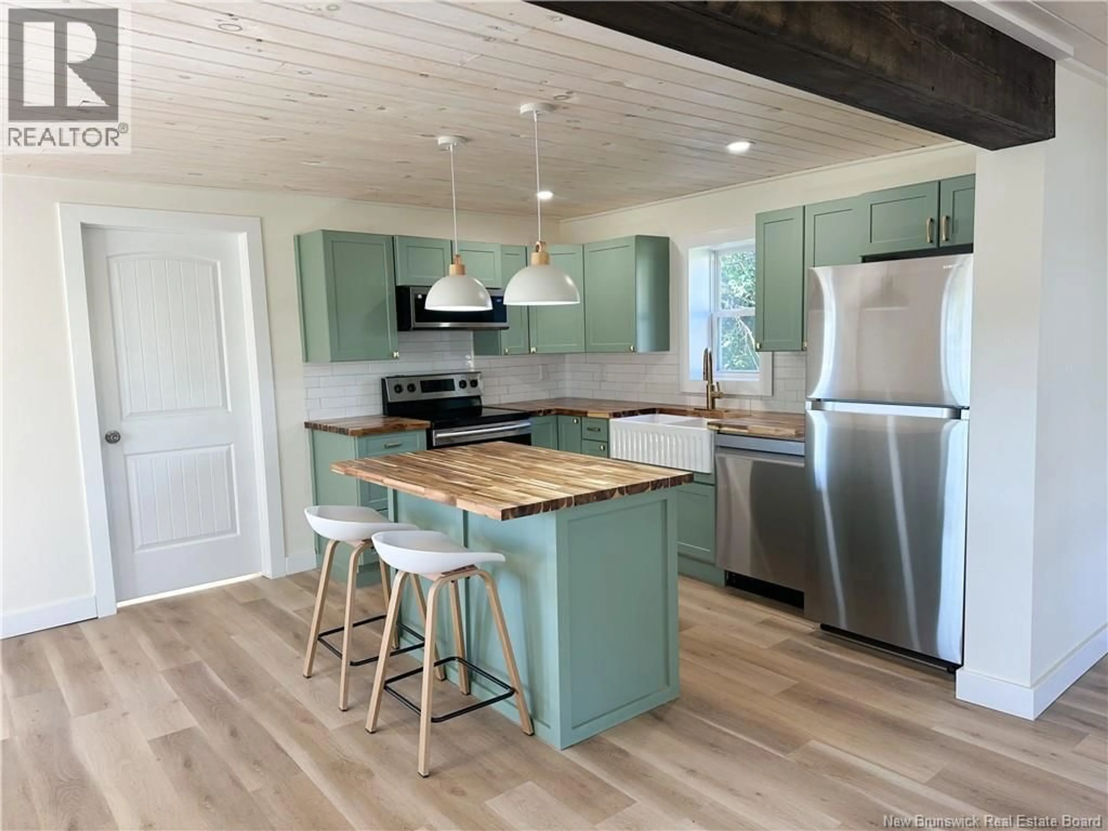 Open concept kitchen, wood/laminate floor for 1950 ROUTE 121 ROUTE, Norton New Brunswick E5T1C5