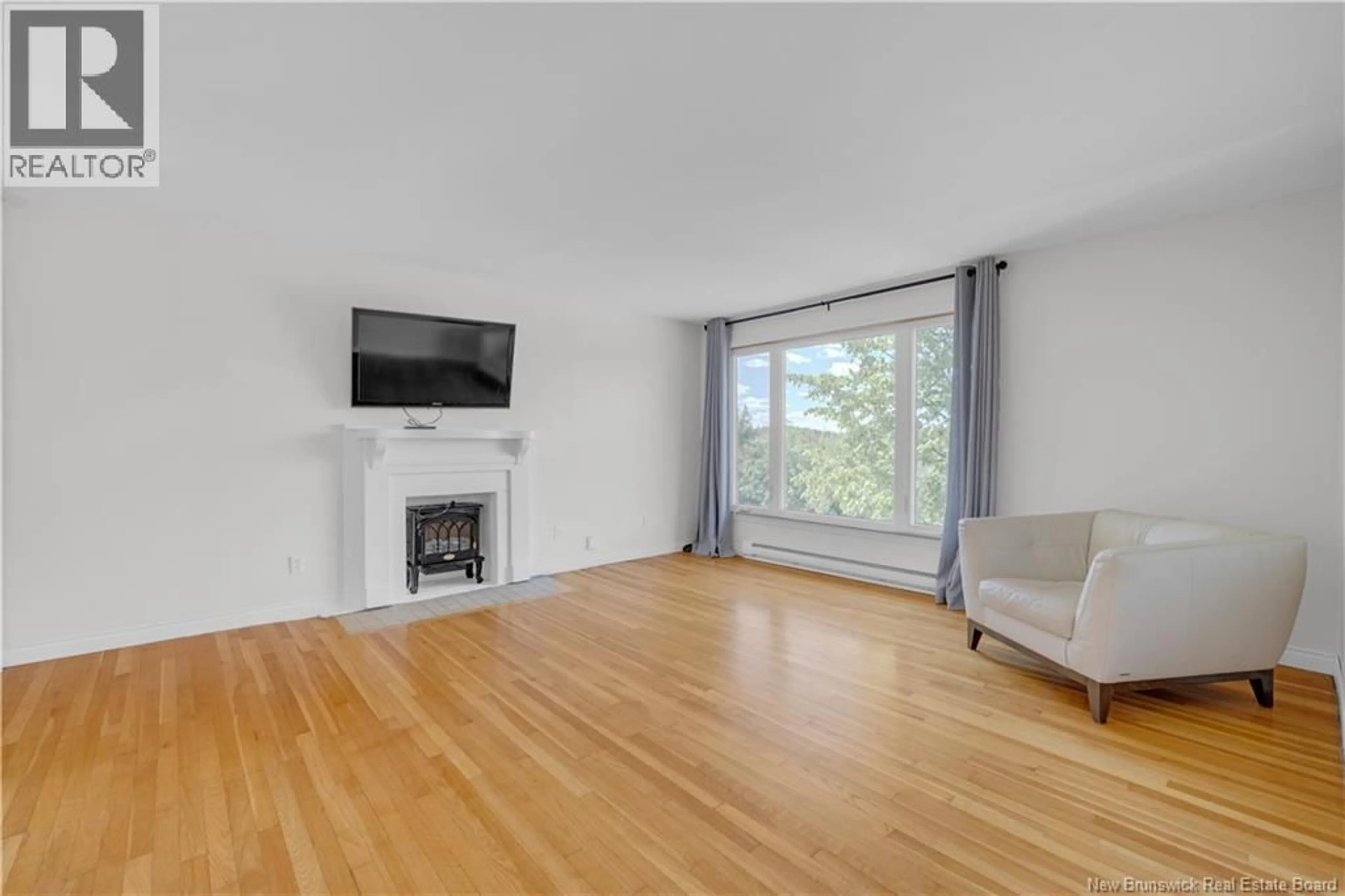Living room with furniture, wood/laminate floor for 30 MCLAUGHLIN CRESCENT, Saint John New Brunswick E2J2K2