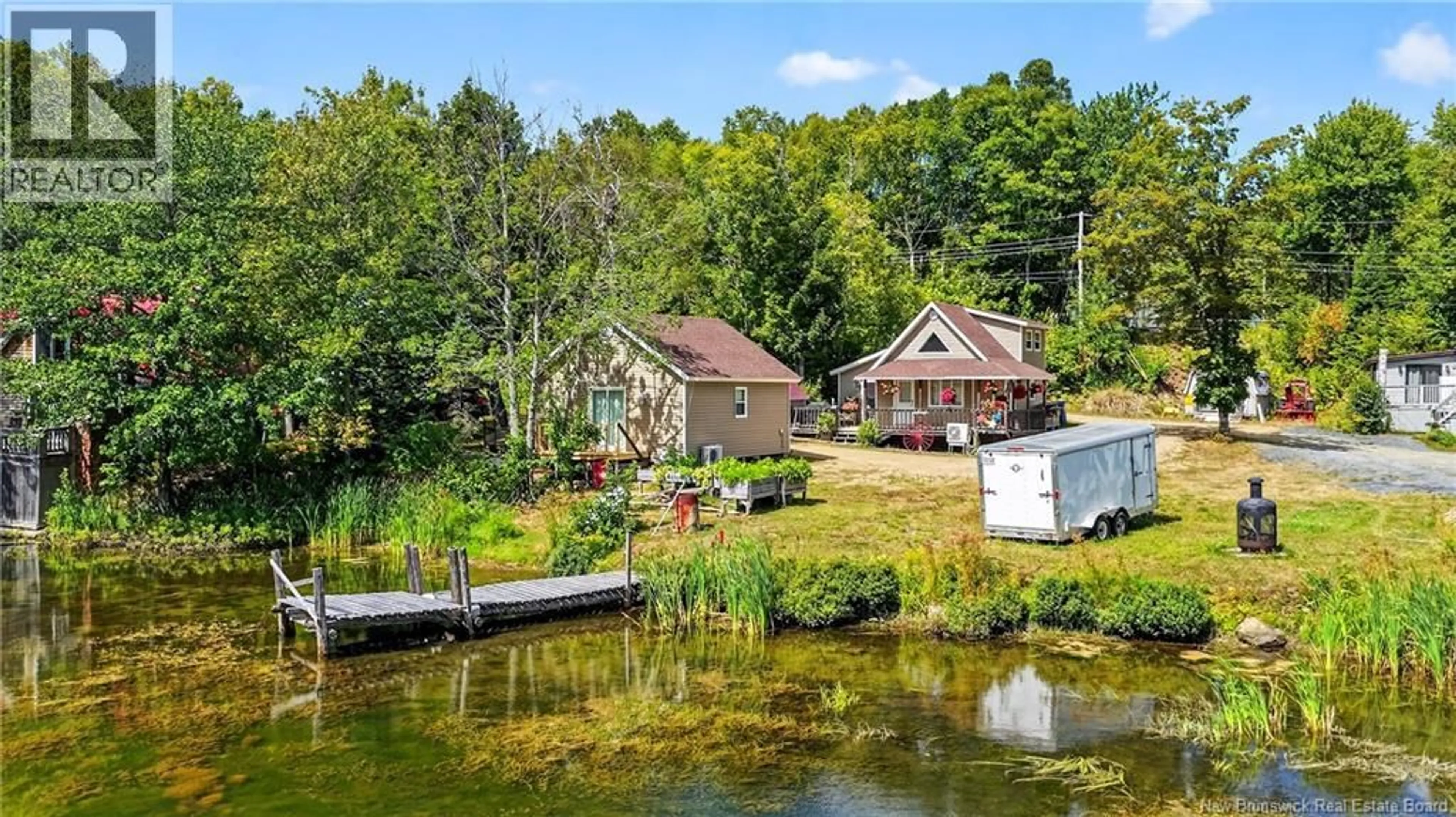 A pic from outside/outdoor area/front of a property/back of a property/a pic from drone, water/lake/river/ocean view for 126 ALLÉE LAC ADAM, Val-Doucet New Brunswick E8R1X4