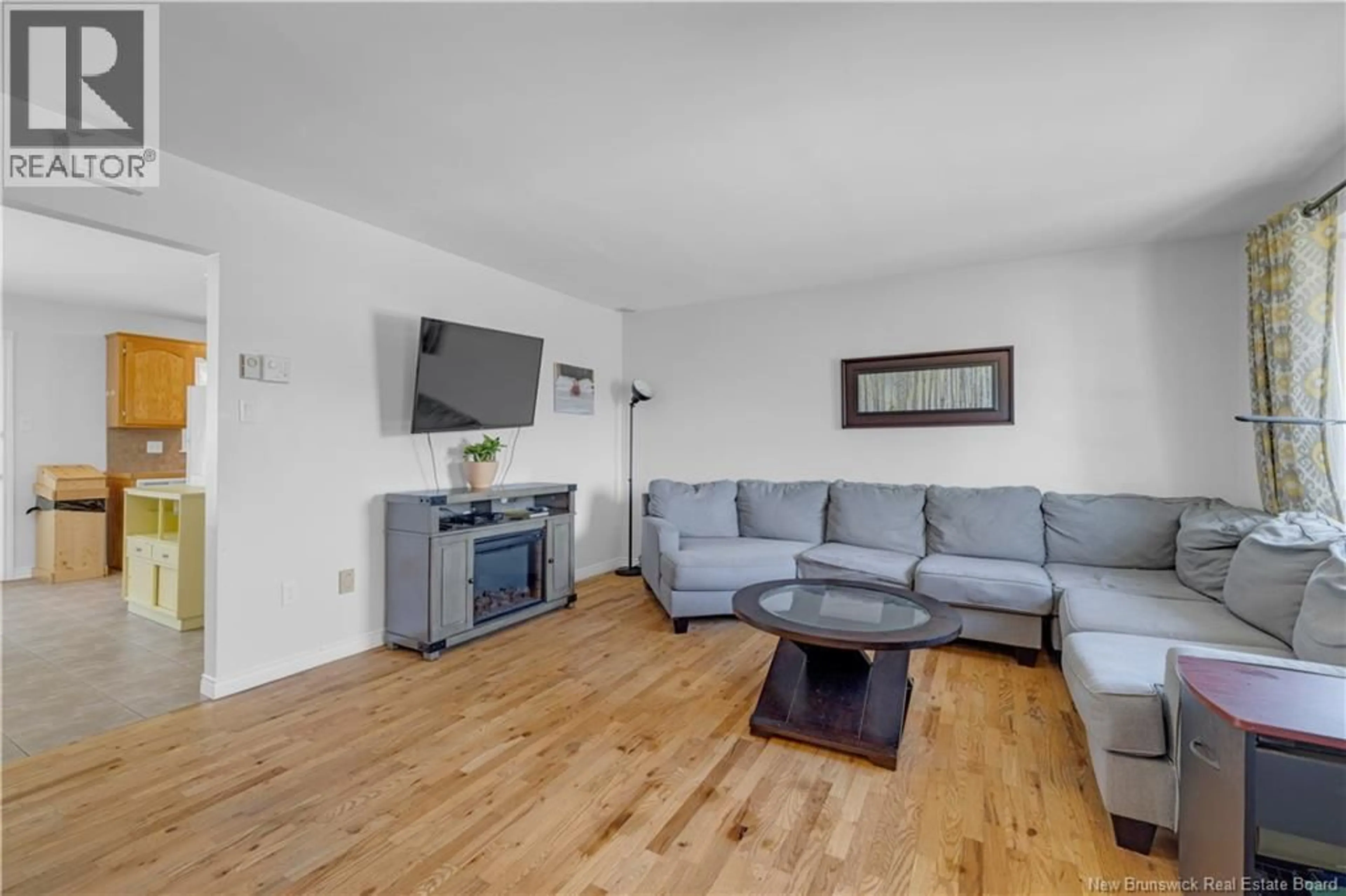 Living room with furniture, wood/laminate floor for 47 BOYANER CRESCENT, Saint John New Brunswick E2J4C8