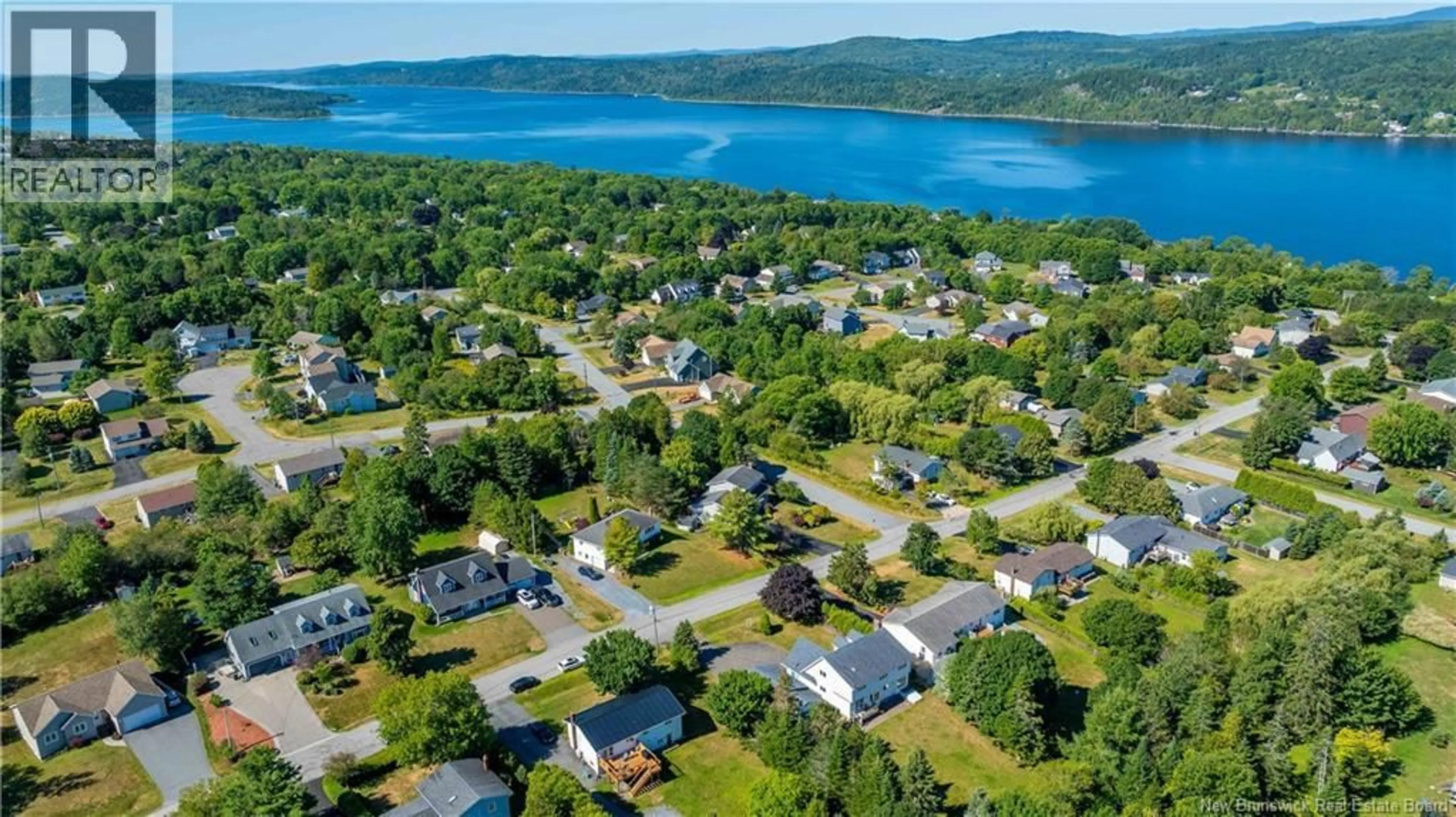 A pic from outside/outdoor area/front of a property/back of a property/a pic from drone, water/lake/river/ocean view for 31 LIONEL DRIVE, Quispamsis New Brunswick E2E1K6