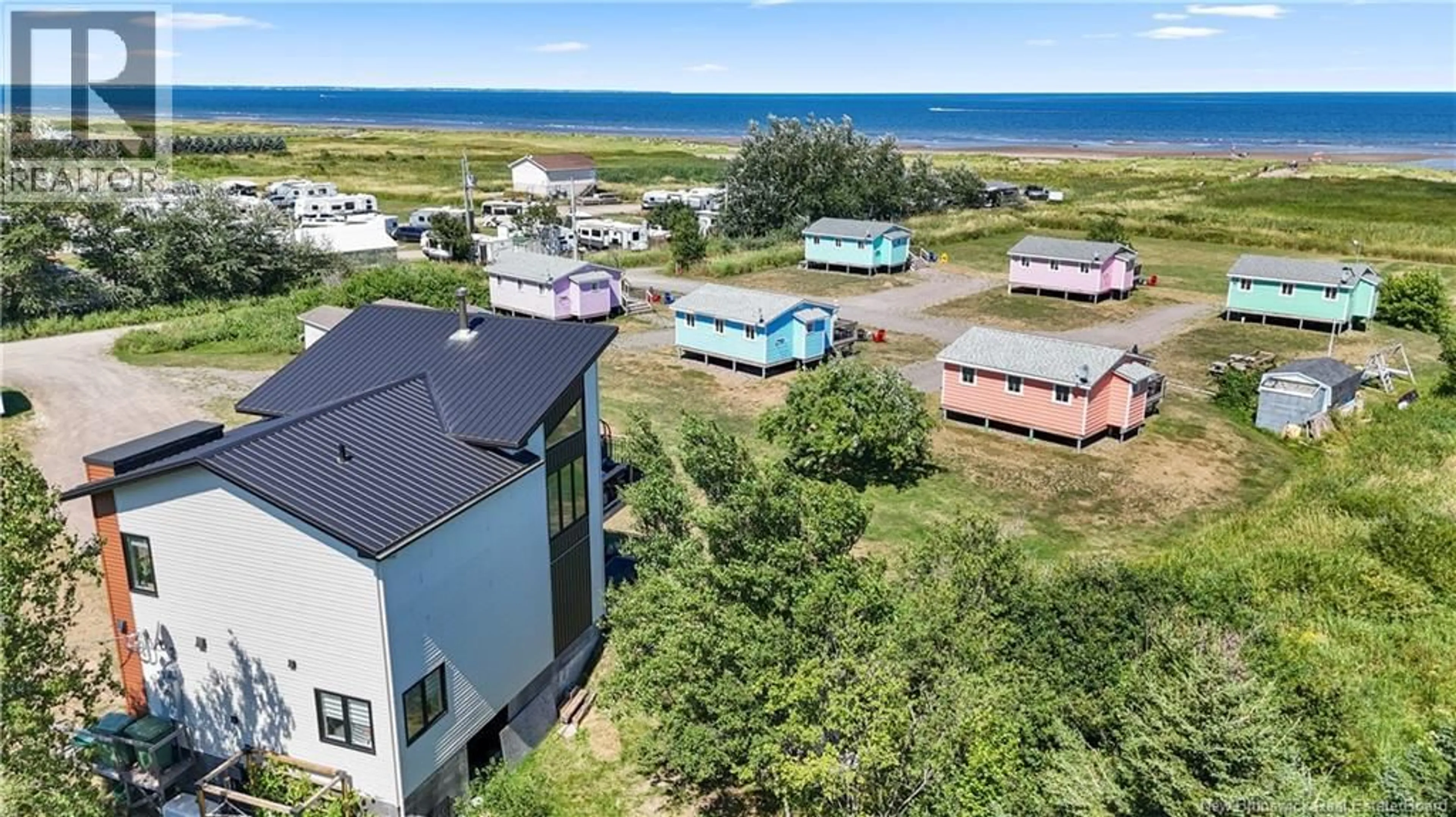 A pic from outside/outdoor area/front of a property/back of a property/a pic from drone, water/lake/river/ocean view for 53-57 CHEMIN PLAGE GAGNON BEACH, Grand-Barachois New Brunswick E4P7Z5