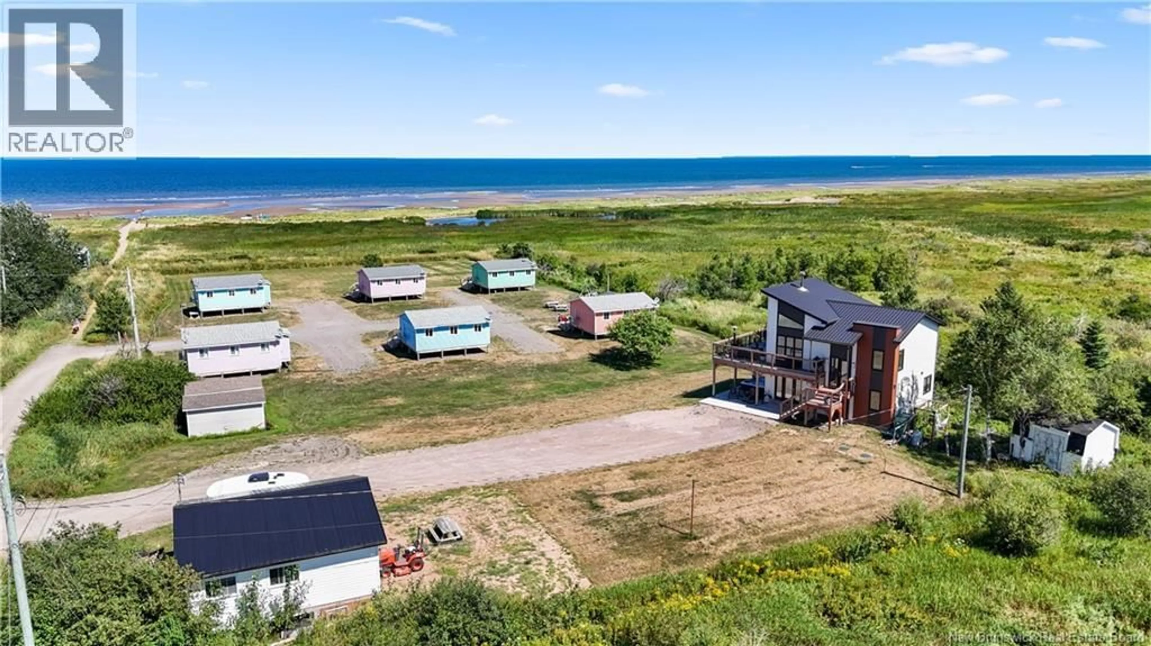 A pic from outside/outdoor area/front of a property/back of a property/a pic from drone, water/lake/river/ocean view for 53-57 CHEMIN PLAGE GAGNON BEACH, Grand-Barachois New Brunswick E4P7Z5