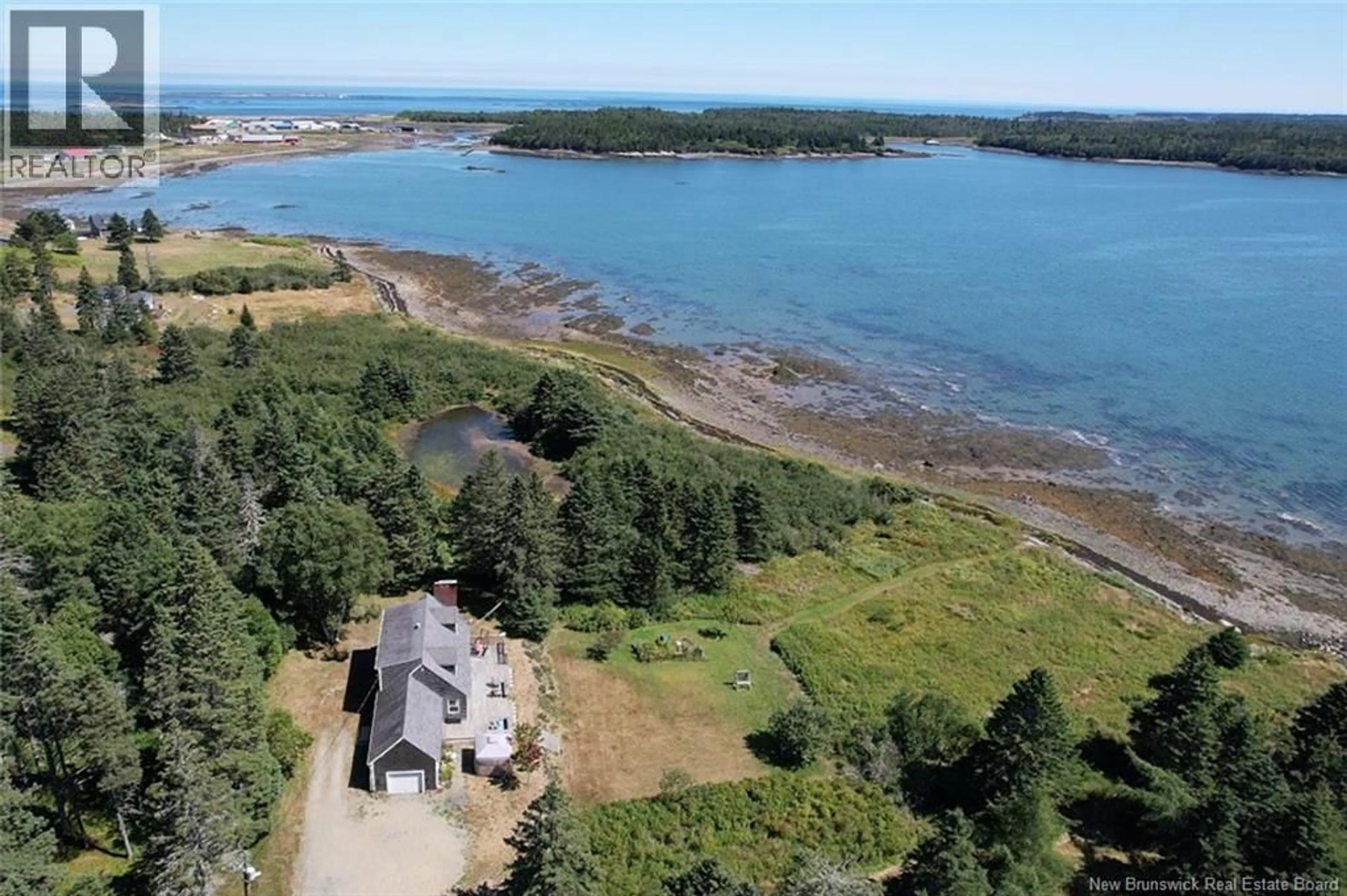 A pic from outside/outdoor area/front of a property/back of a property/a pic from drone, water/lake/river/ocean view for 25 SHADY LANE, Grand Manan New Brunswick E5G2G1
