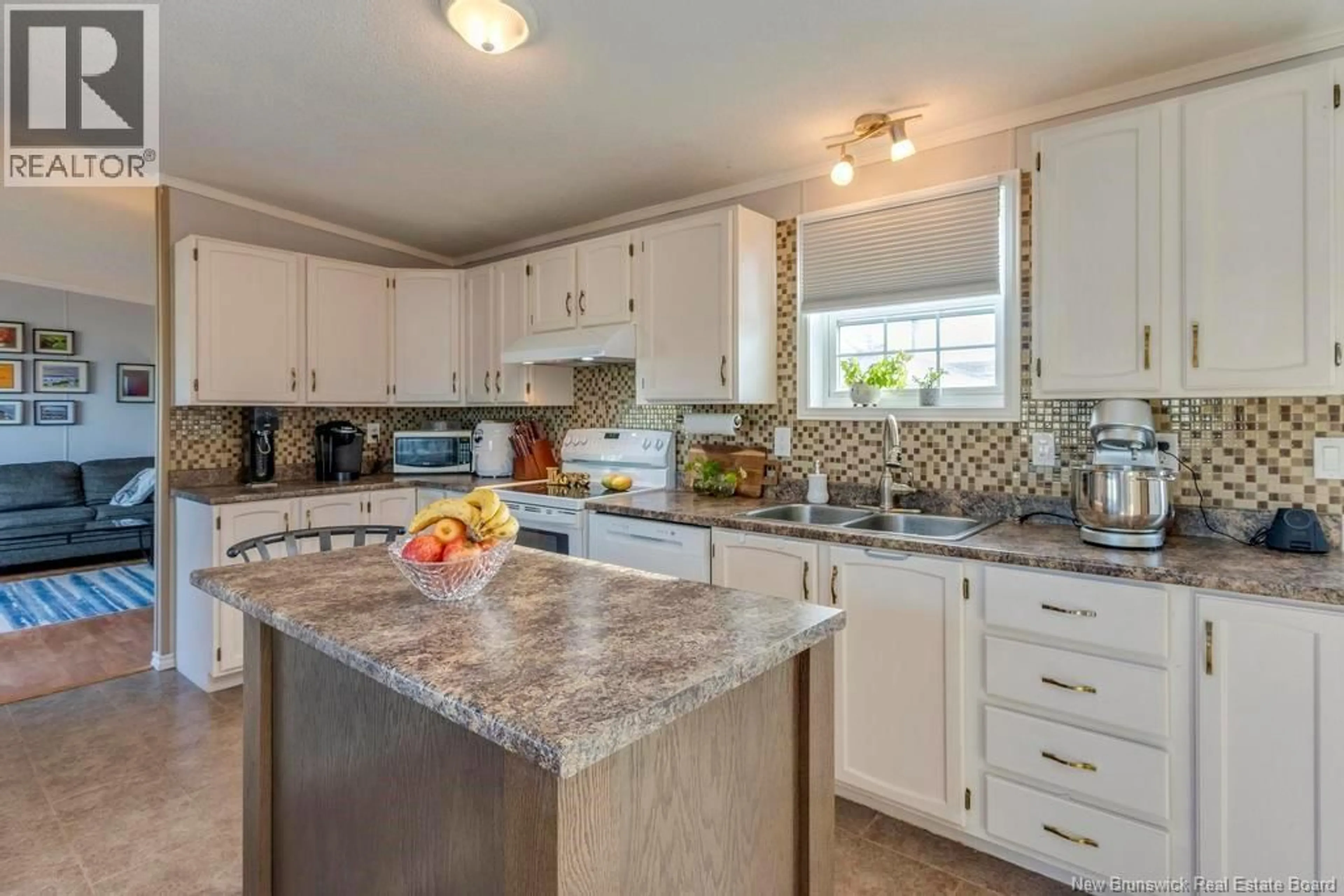 Open concept kitchen, ceramic/tile floor for 16 RESTIGOUCHE DRIVE, Dieppe New Brunswick E1A7N1