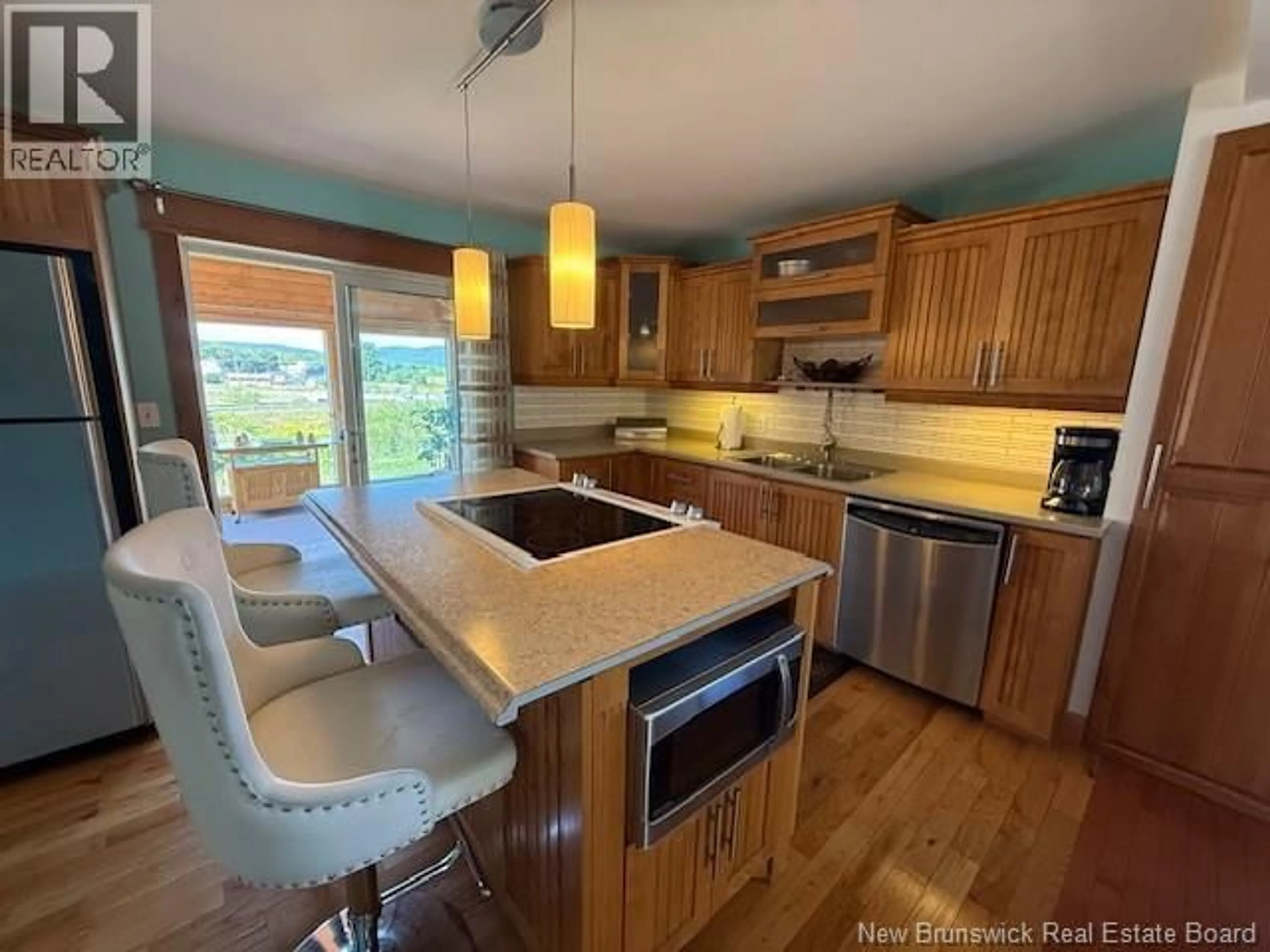 Open concept kitchen, wood/laminate floor for 47 SUNSET DRIVE, Campbellton New Brunswick E3N1S4