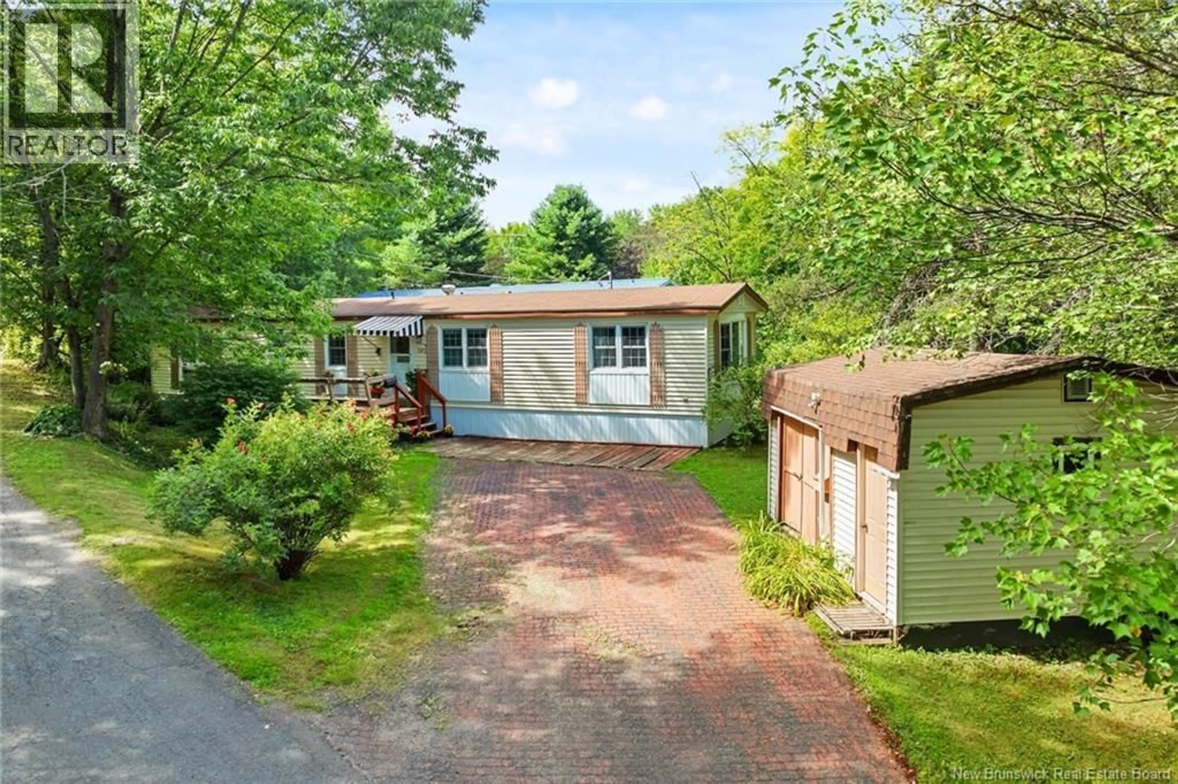 A pic from outside/outdoor area/front of a property/back of a property/a pic from drone, street for 392 ABBEY LANE, Fredericton New Brunswick E3B7K7
