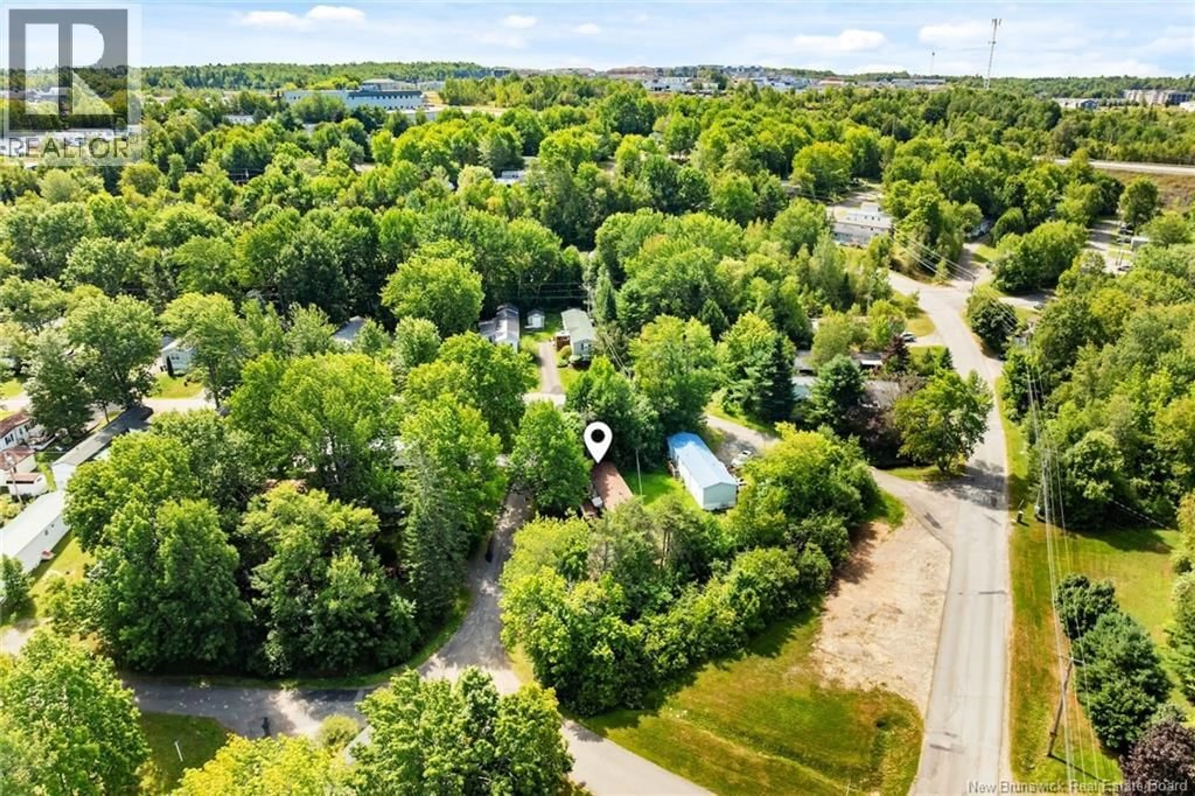 A pic from outside/outdoor area/front of a property/back of a property/a pic from drone, forest/trees view for 392 ABBEY LANE, Fredericton New Brunswick E3B7K7