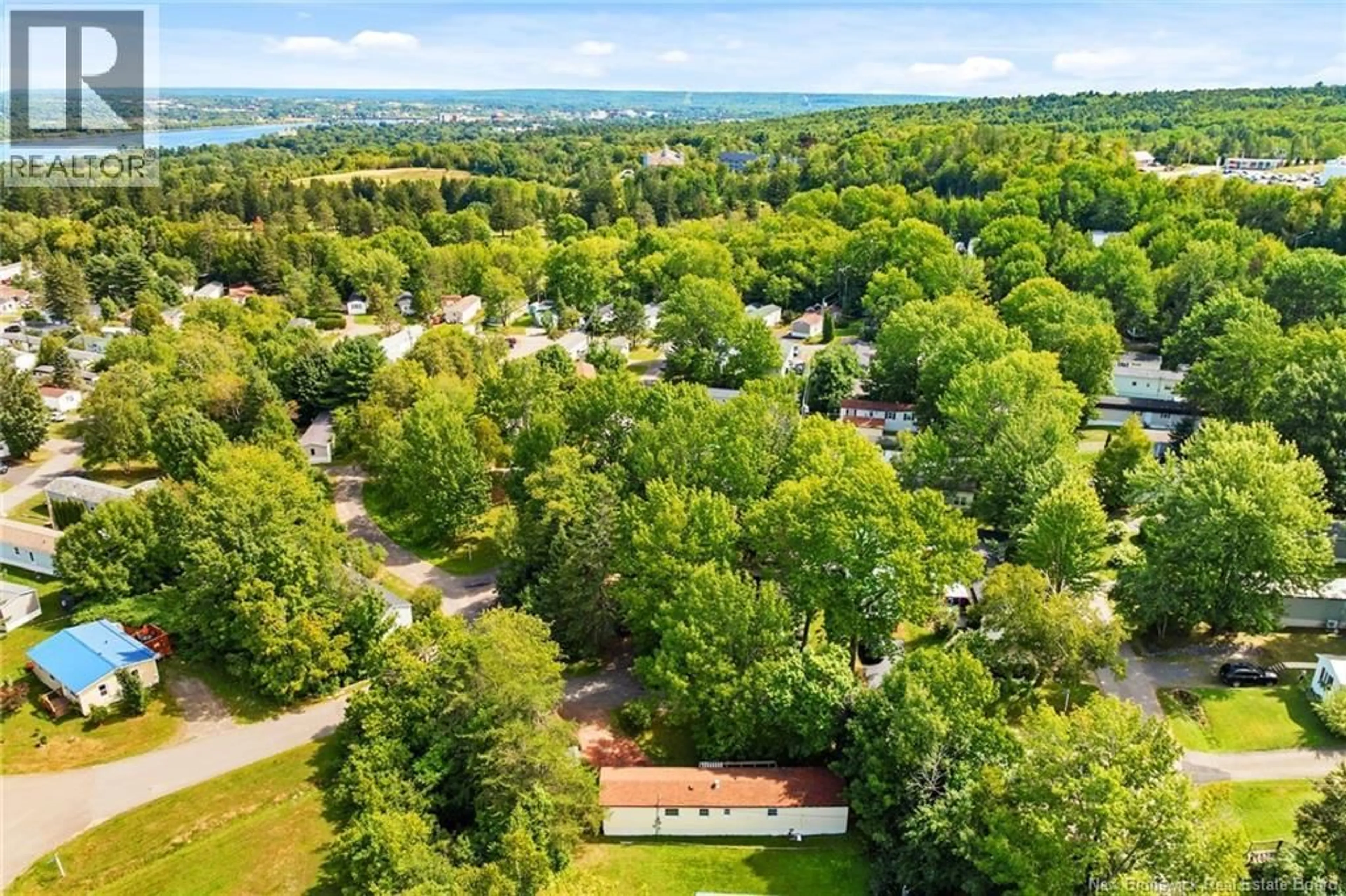 A pic from outside/outdoor area/front of a property/back of a property/a pic from drone, forest/trees view for 392 ABBEY LANE, Fredericton New Brunswick E3B7K7