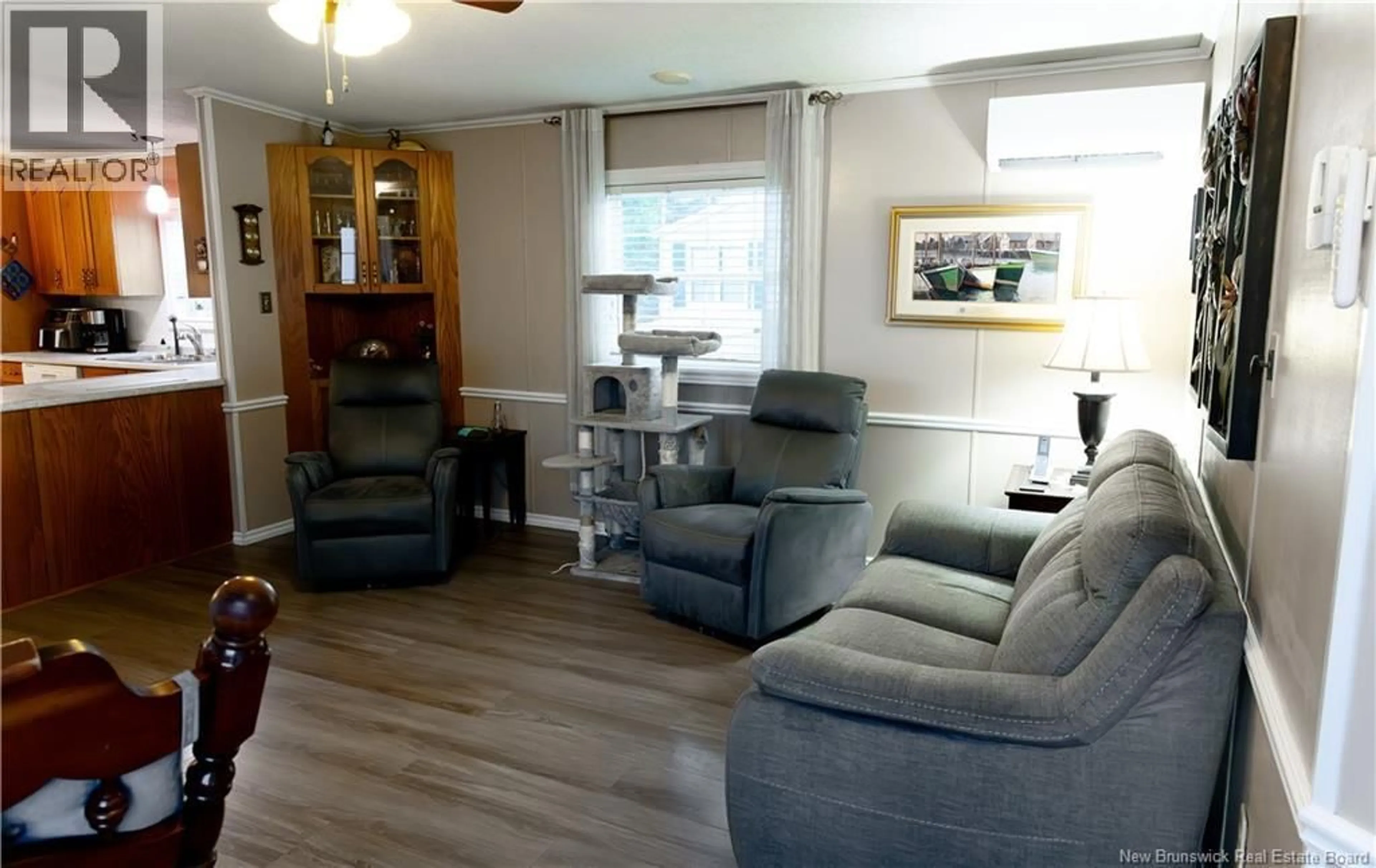 Living room with furniture, wood/laminate floor for 01 BLUE JAY, Moncton New Brunswick E1A2S1
