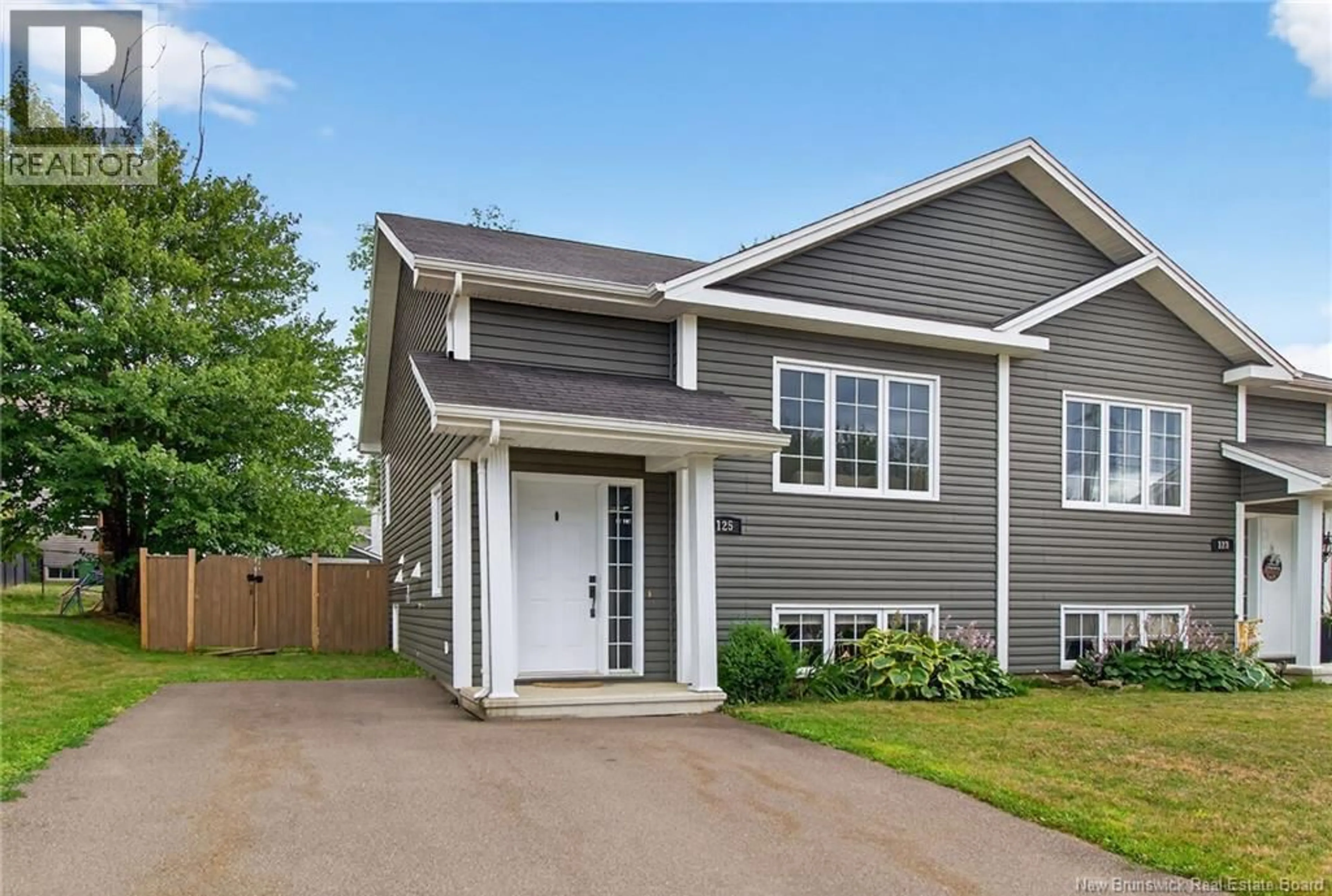 Home with vinyl exterior material, street for 125 BELLE FORET STREET, Dieppe New Brunswick E1A9E6
