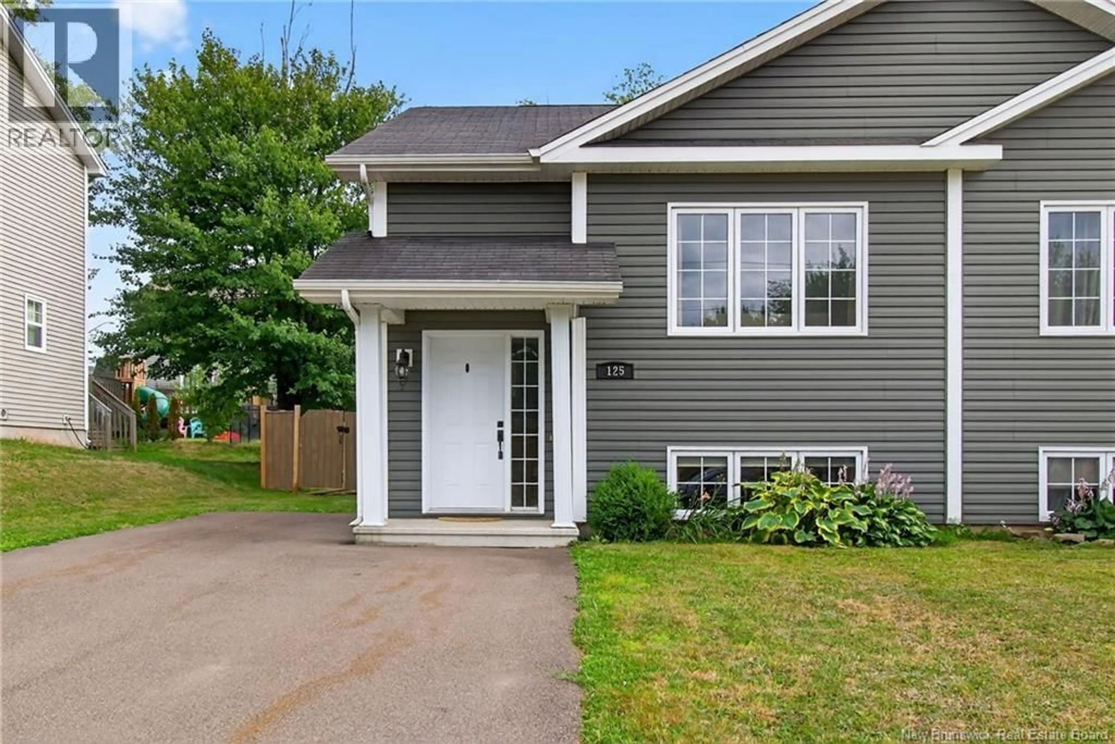 Home with vinyl exterior material, street for 125 BELLE FORET STREET, Dieppe New Brunswick E1A9E6