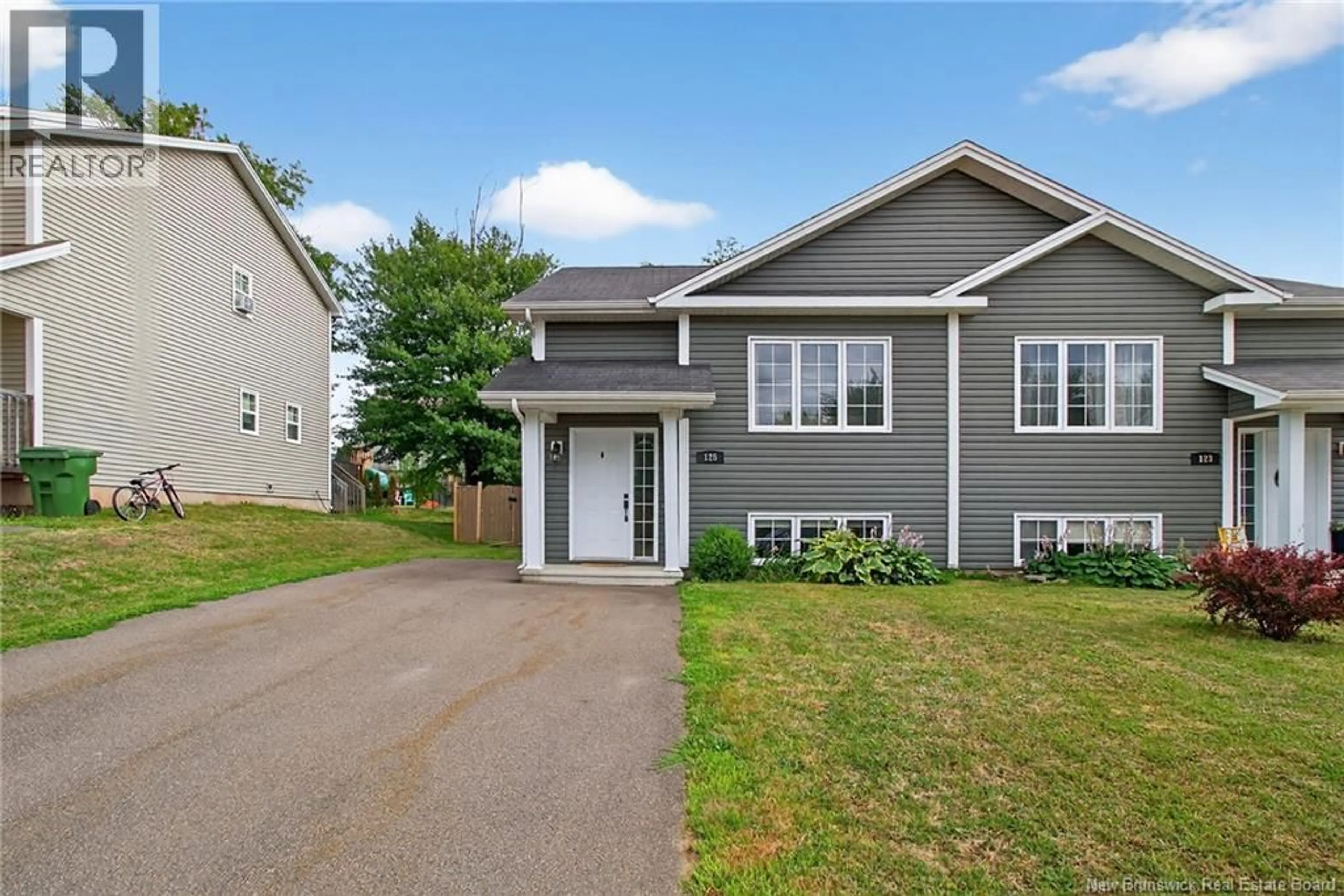 Home with vinyl exterior material, street for 125 BELLE FORET STREET, Dieppe New Brunswick E1A9E6