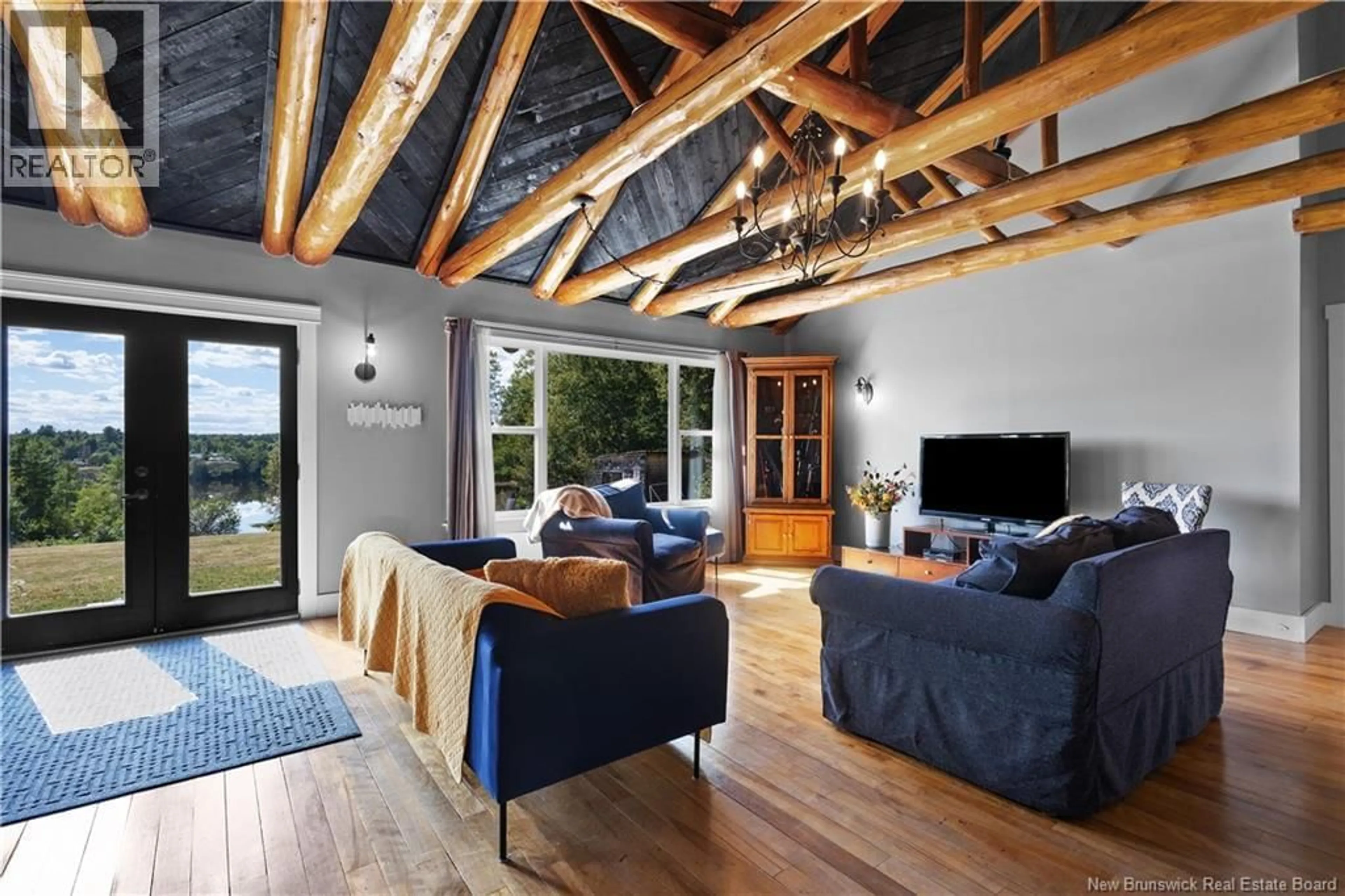 Living room with furniture, wood/laminate floor for 21 TOZER LANE, Sunny Corner New Brunswick E9E1S7