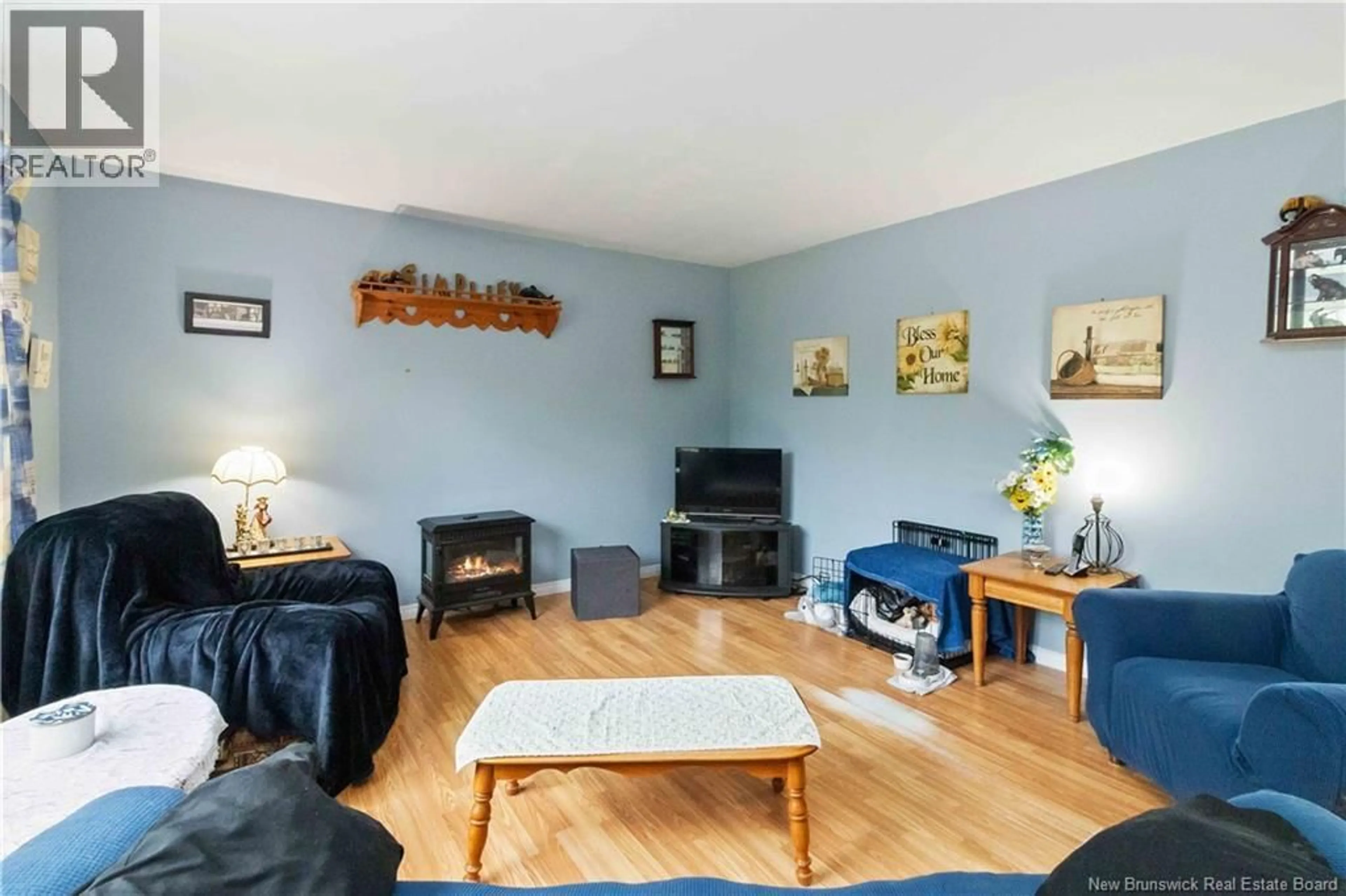 Living room with furniture, wood/laminate floor for 136 PACIFIC JUNCTION ROAD, Moncton New Brunswick E1G2N8