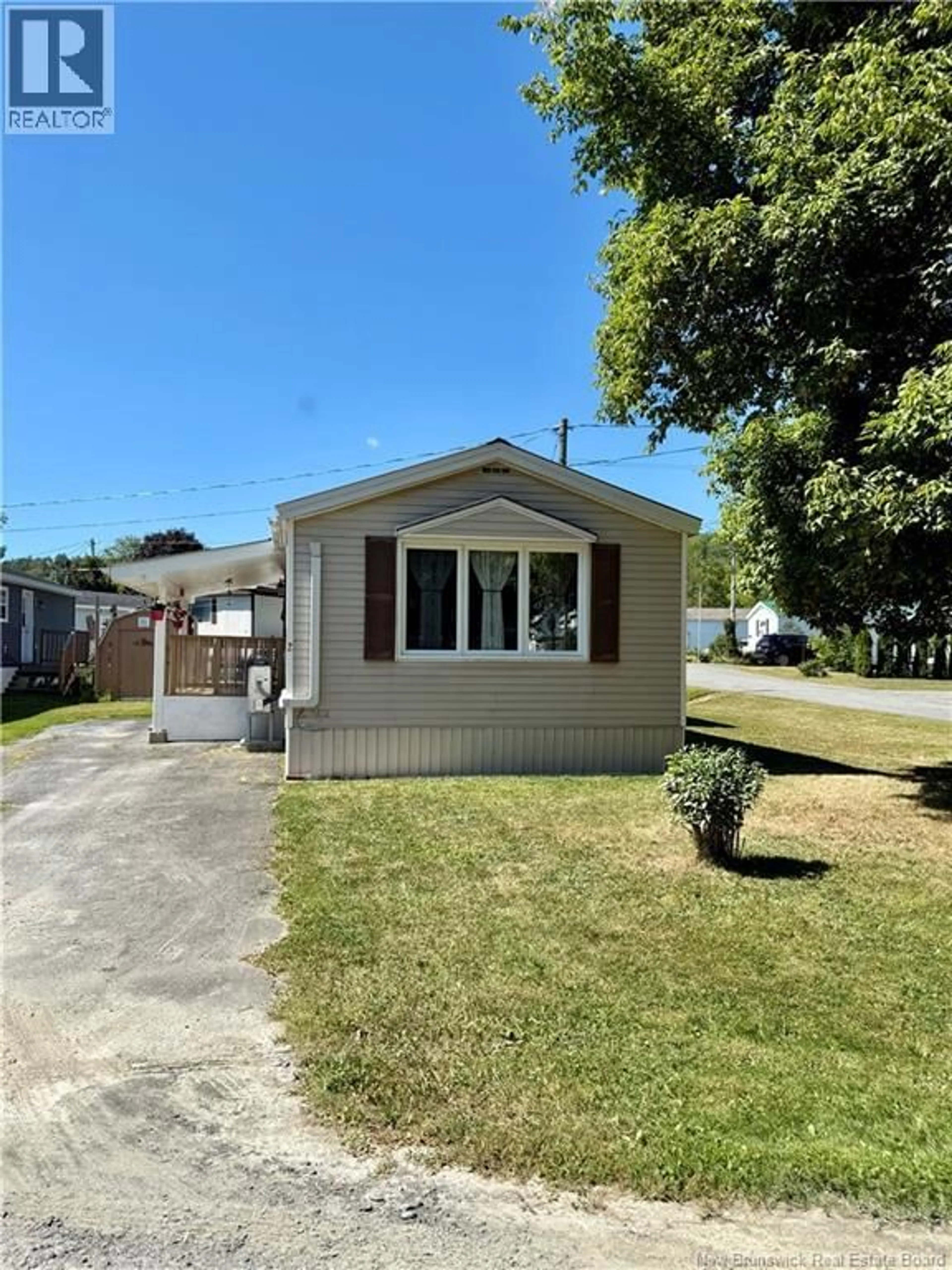 Home with vinyl exterior material, street for 2 POULIN DRIVE, Woodstock New Brunswick E7M2L8