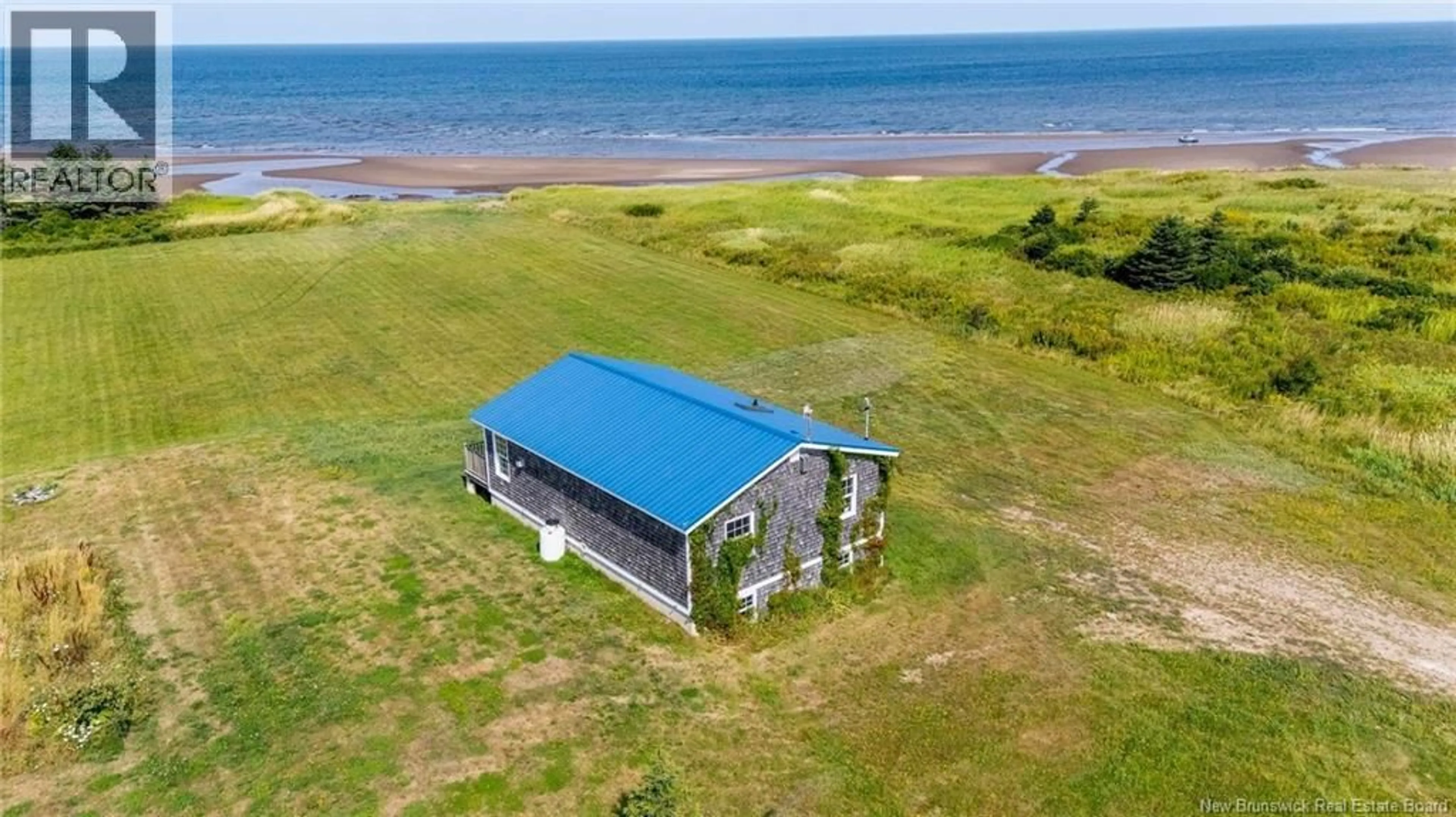 A pic from outside/outdoor area/front of a property/back of a property/a pic from drone, water/lake/river/ocean view for 217 BEACH MEADOWS LANE, Little Shemogue New Brunswick E4M0A4
