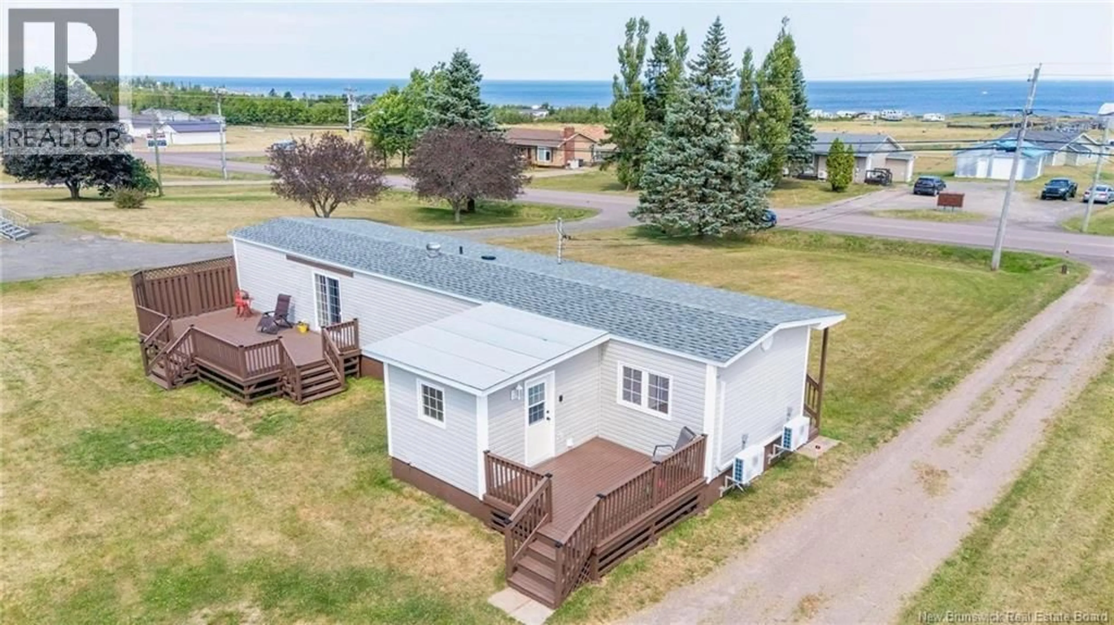 A pic from outside/outdoor area/front of a property/back of a property/a pic from drone, water/lake/river/ocean view for 2021 RTE 950, Petit-Cap New Brunswick E4N2H5