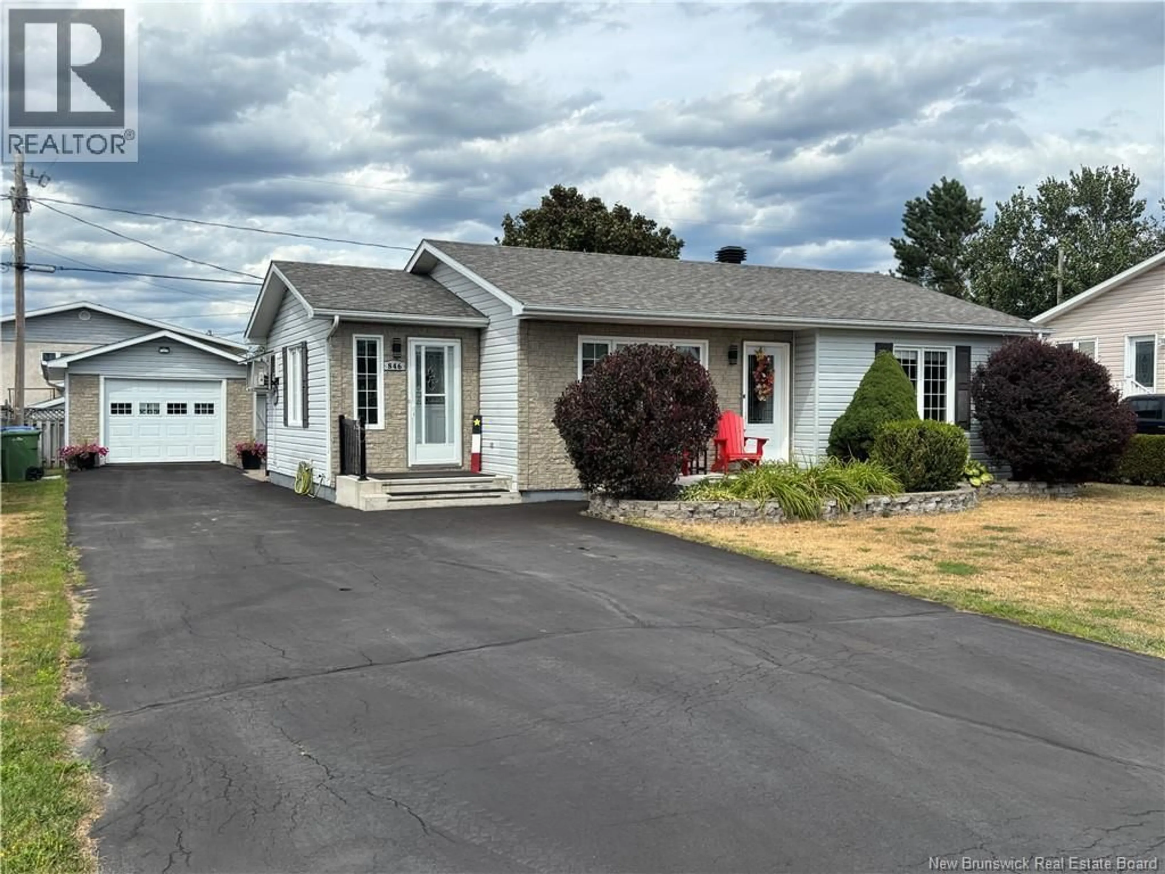 Home with vinyl exterior material, street for 846 RUE ST-PIERRE, Beresford New Brunswick E8K1S2
