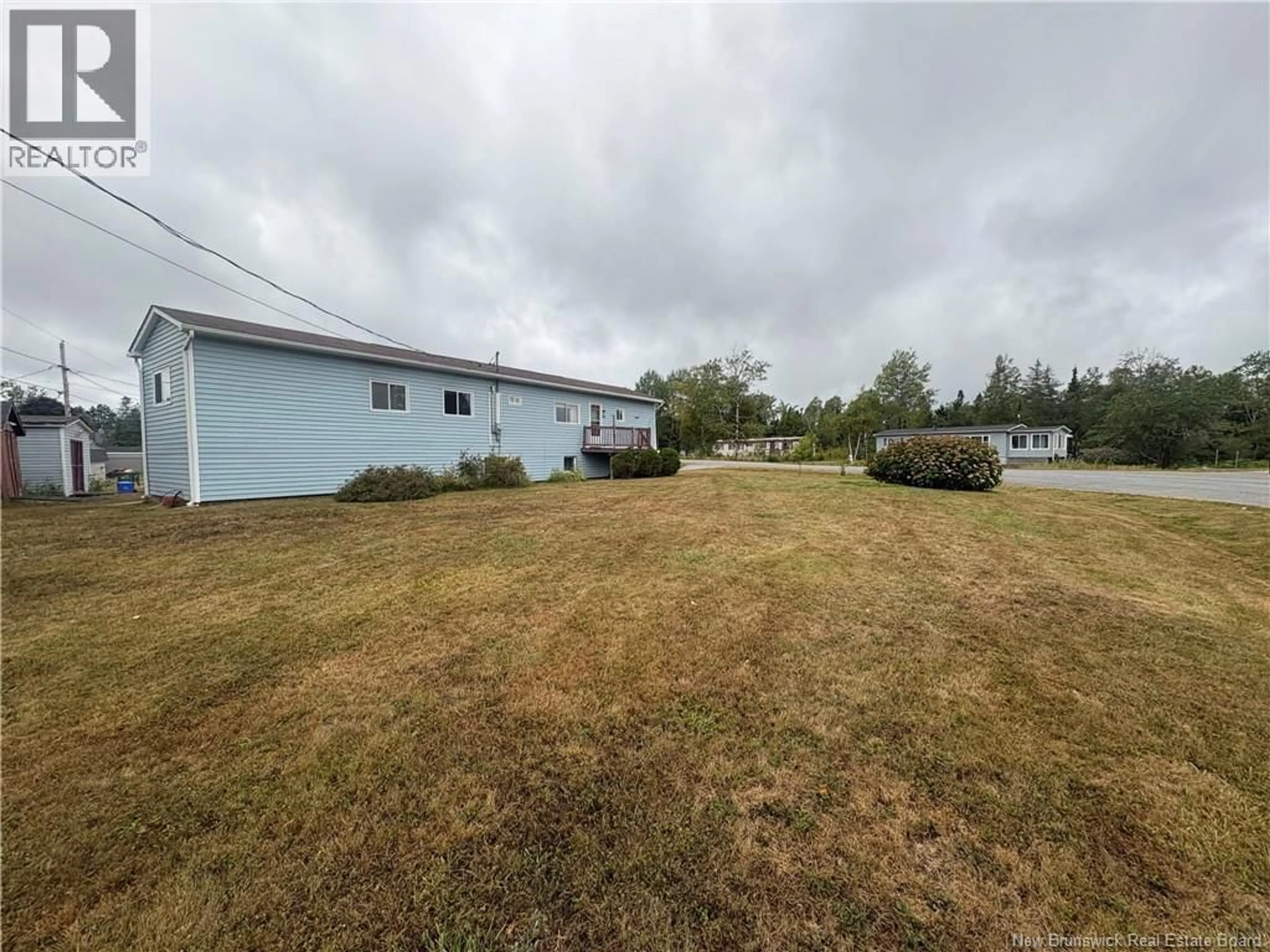 A pic from outside/outdoor area/front of a property/back of a property/a pic from drone, water/lake/river/ocean view for 2 ALLEN AVENUE, Musquash New Brunswick E5J2G5