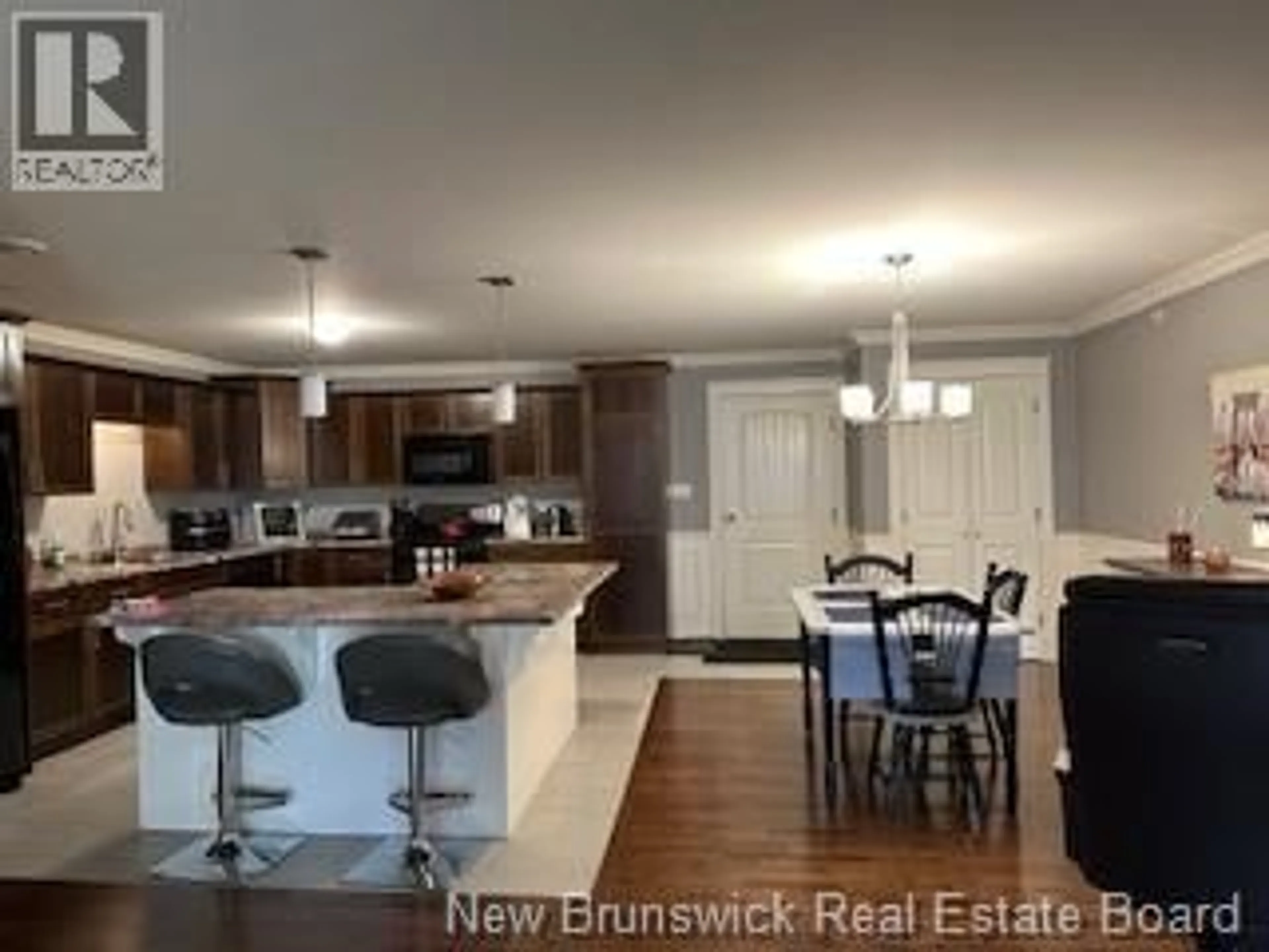 Open concept kitchen, wood/laminate floor for 440 - 155 LIAN STREET, Fredericton New Brunswick E3C0L9