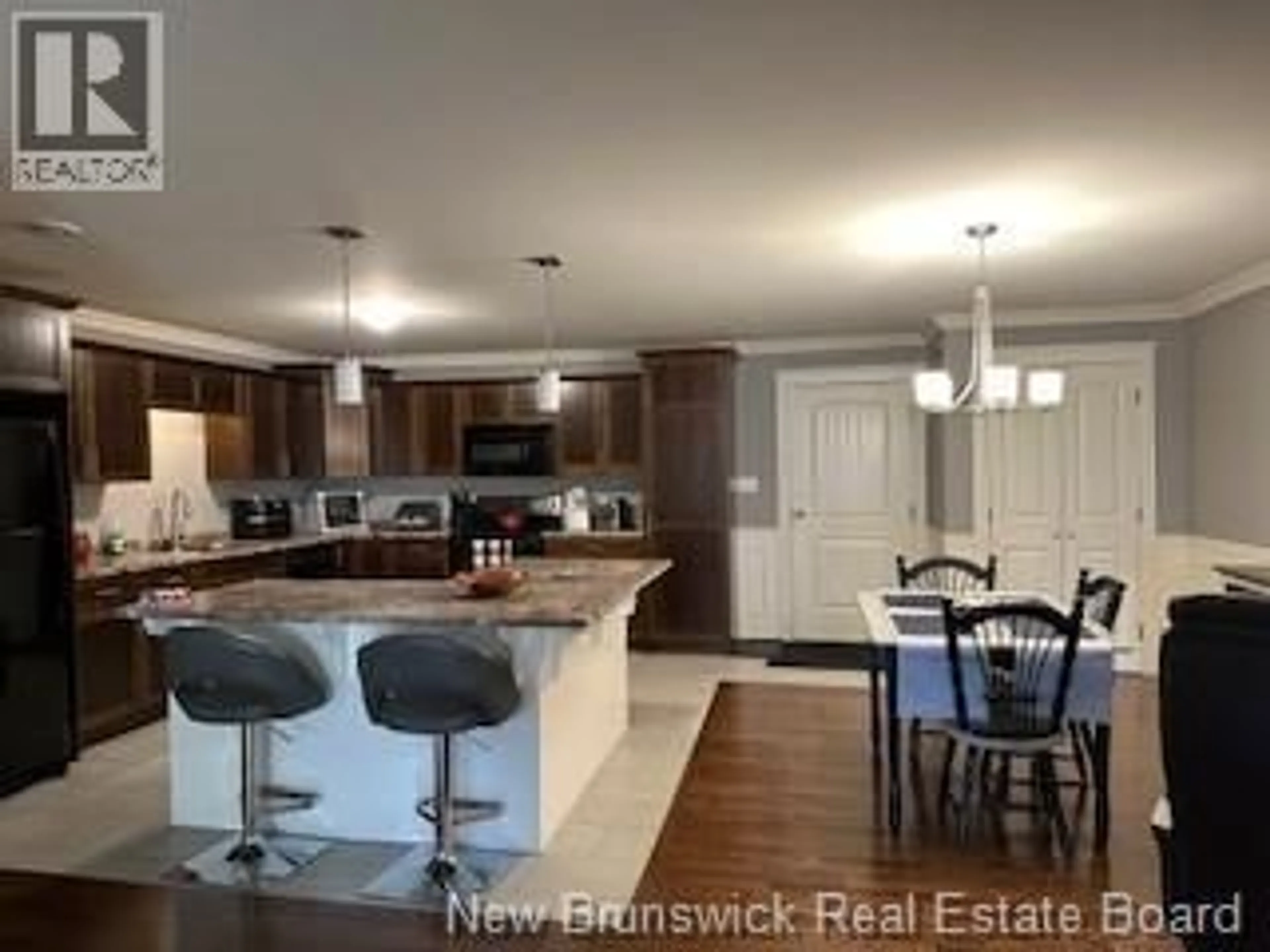 Open concept kitchen, wood/laminate floor for 440 - 155 LIAN STREET, Fredericton New Brunswick E3C0L9