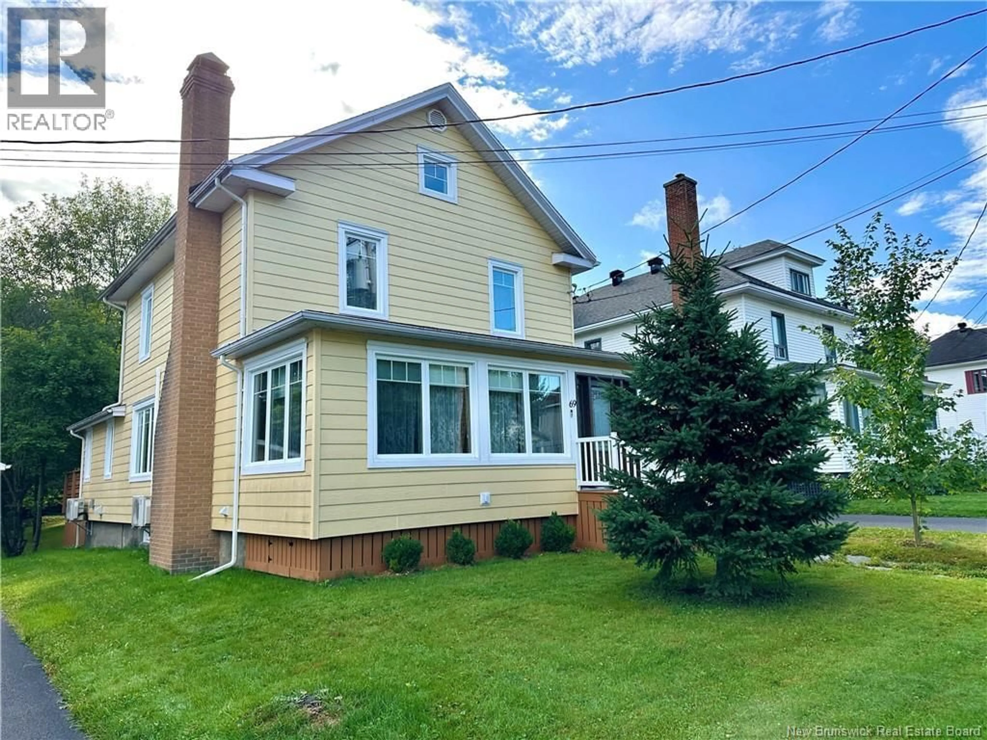 Home with vinyl exterior material, street for 69 FRASER AVENUE, Edmundston New Brunswick E3V2B6