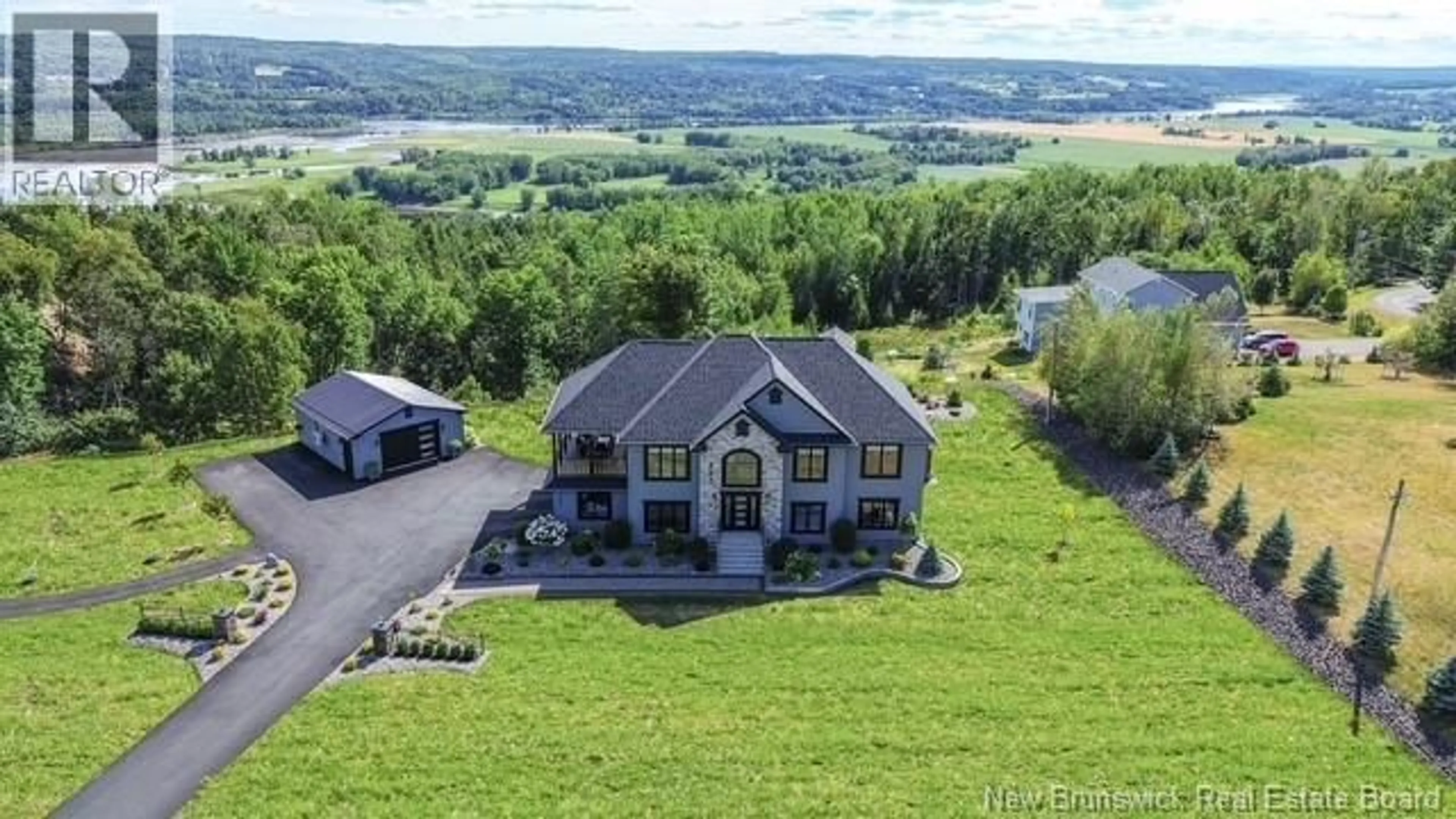 A pic from outside/outdoor area/front of a property/back of a property/a pic from drone, water/lake/river/ocean view for 207 CARLISLE ROAD, Douglas New Brunswick E3G7M9