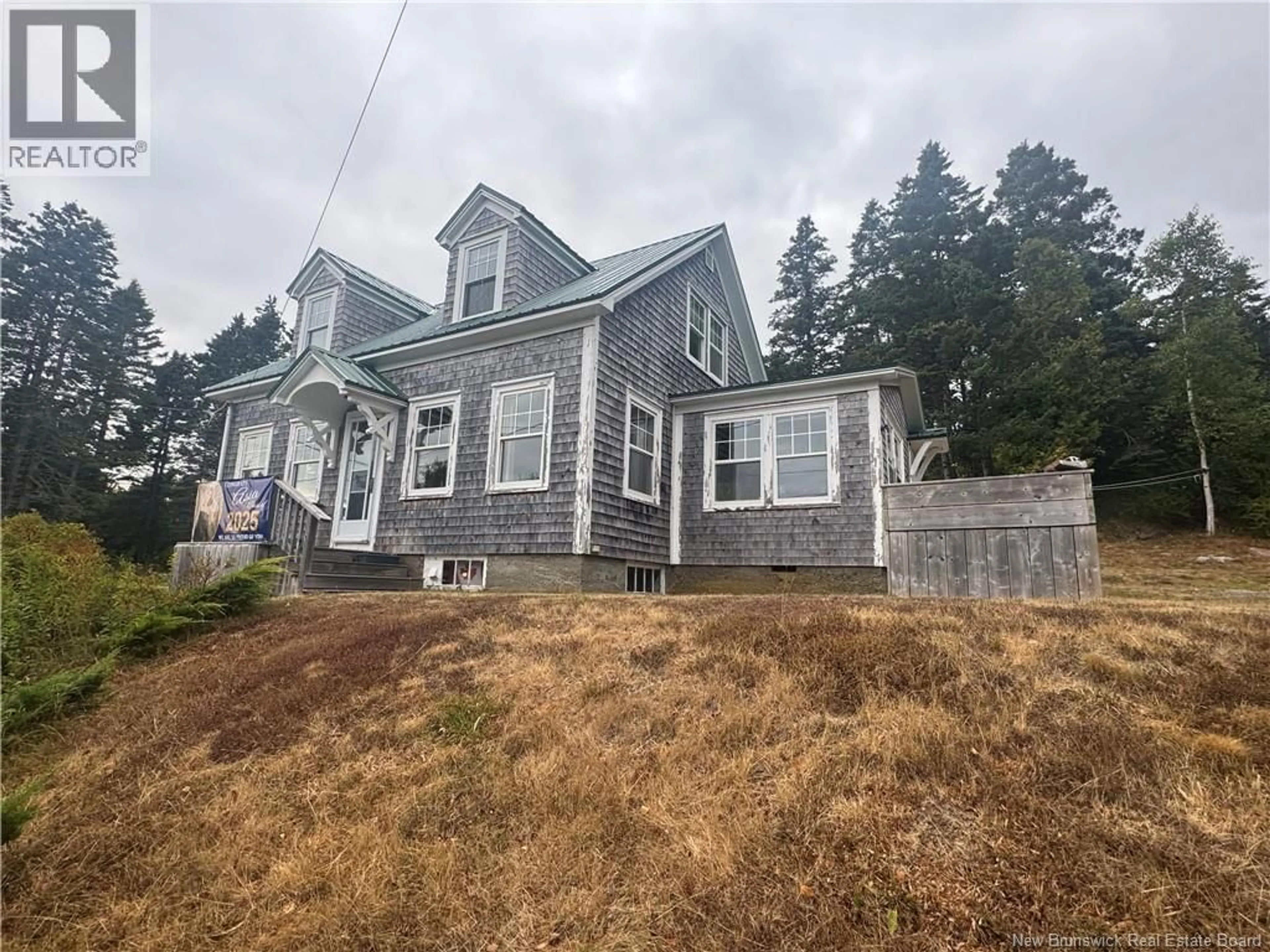 A pic from outside/outdoor area/front of a property/back of a property/a pic from drone, building for 106 ROUTE 776, Grand Manan New Brunswick E5G1A1