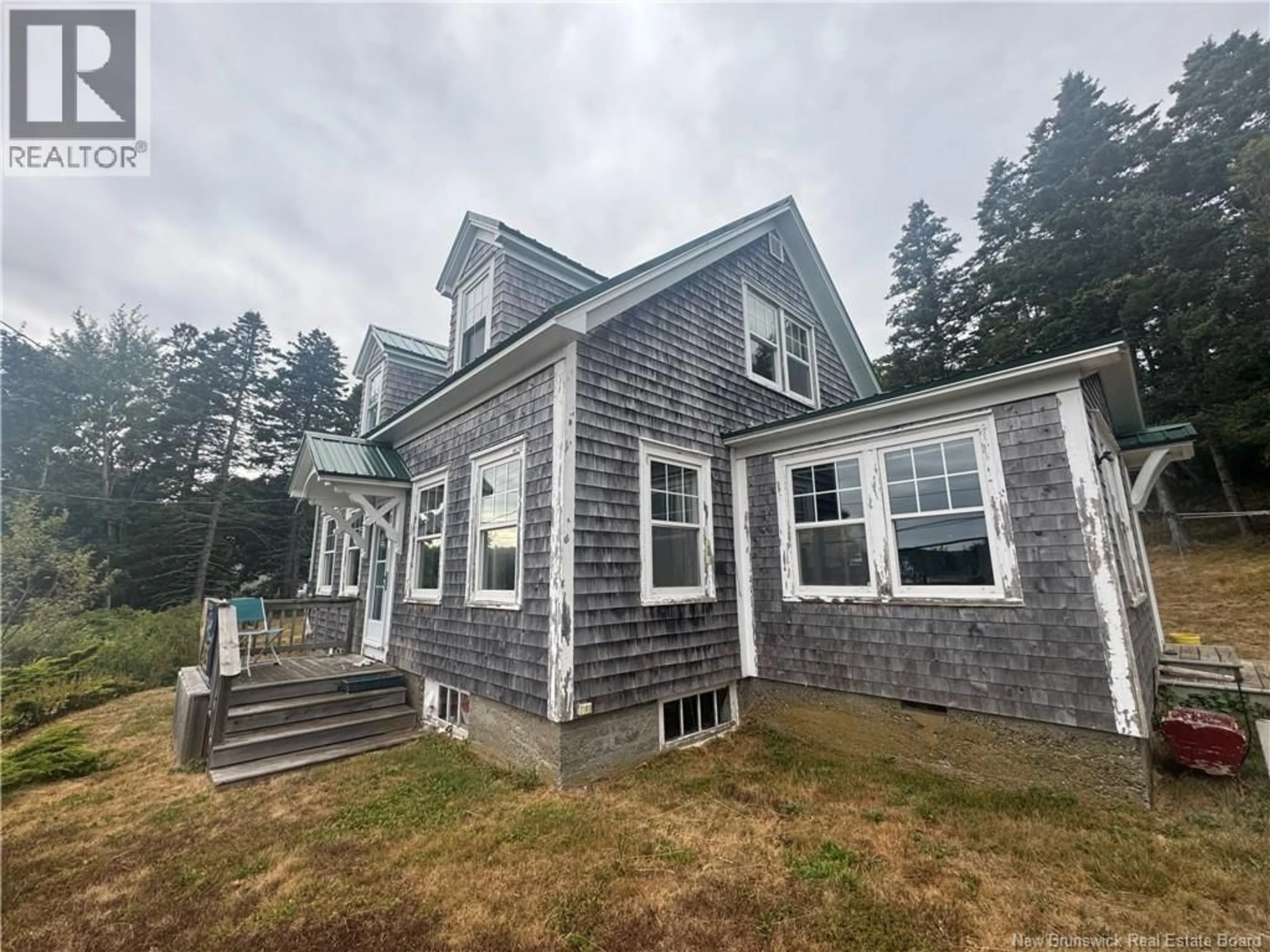 A pic from outside/outdoor area/front of a property/back of a property/a pic from drone, building for 106 ROUTE 776, Grand Manan New Brunswick E5G1A1