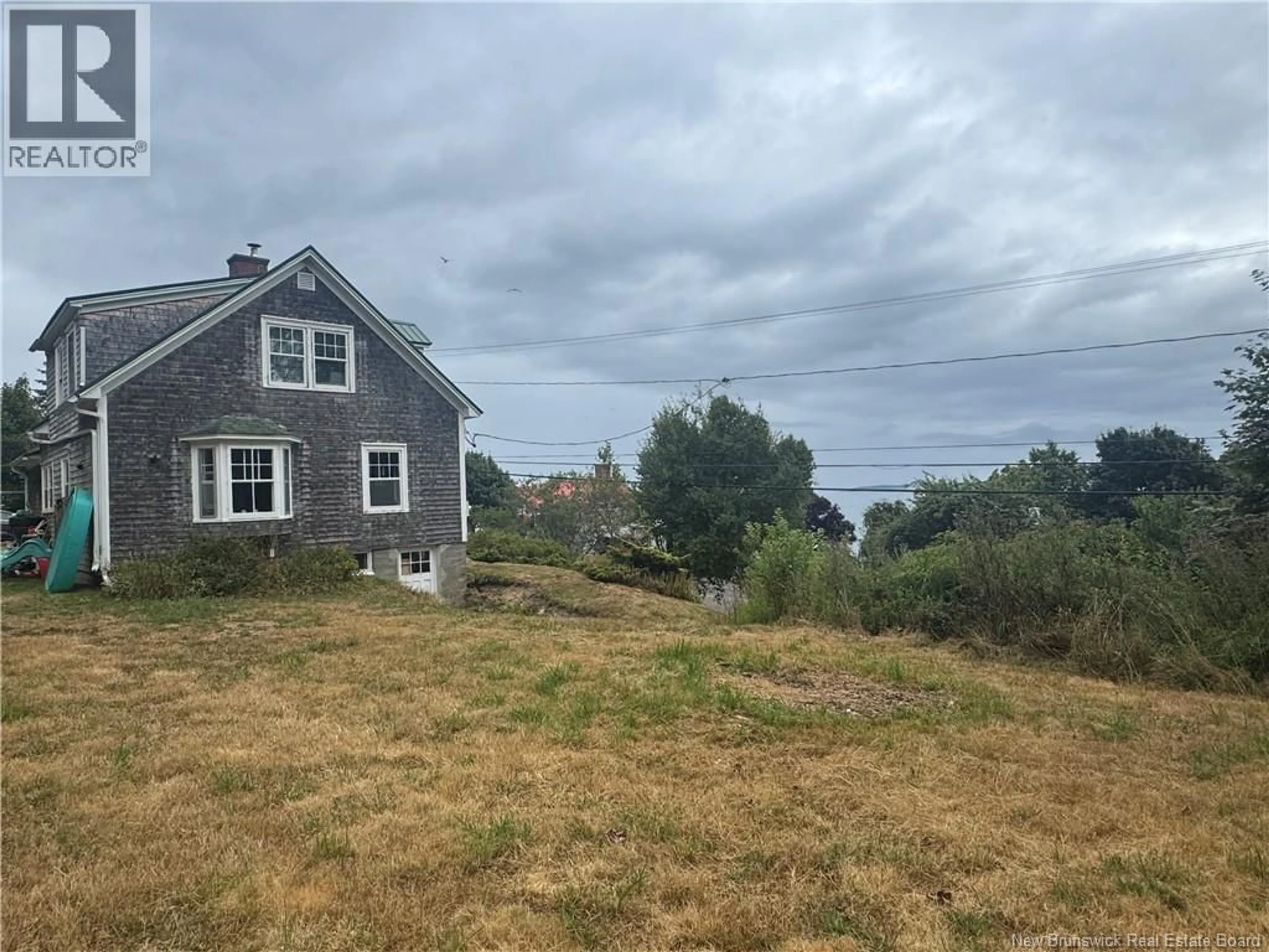 A pic from outside/outdoor area/front of a property/back of a property/a pic from drone, water/lake/river/ocean view for 106 ROUTE 776, Grand Manan New Brunswick E5G1A1