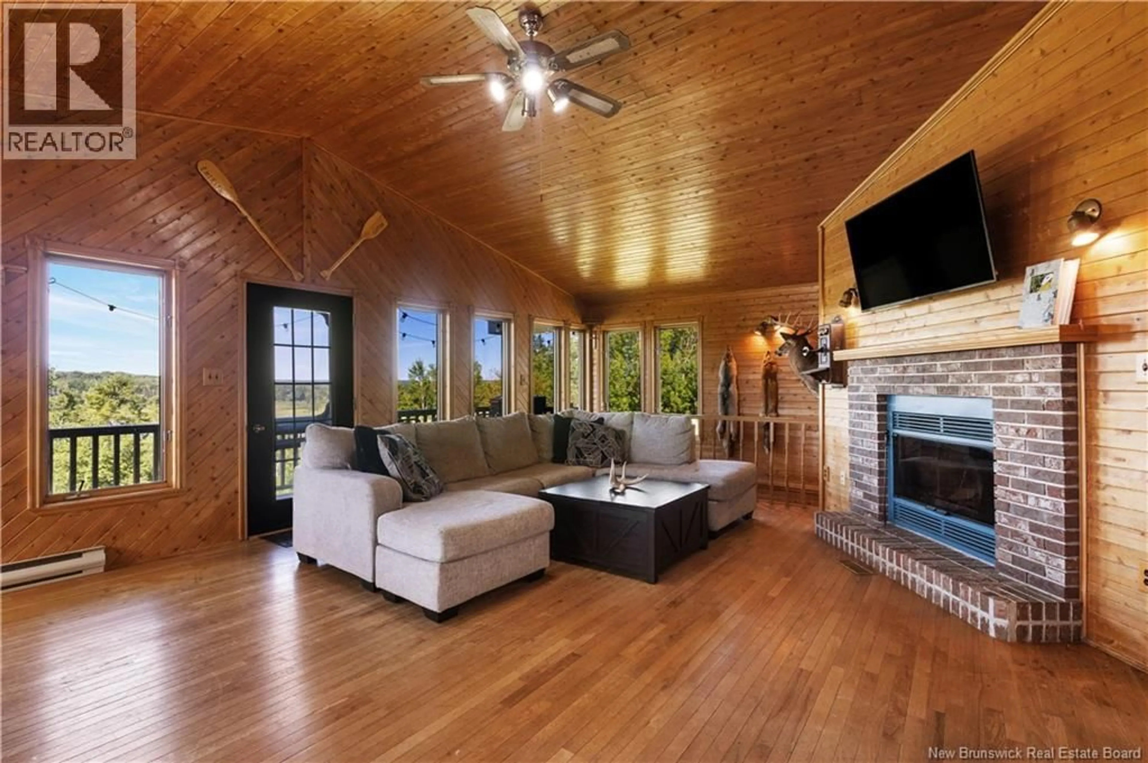 Living room with furniture, wood/laminate floor for 19 TOZER LANE, Sunny Corner New Brunswick E9E1S7