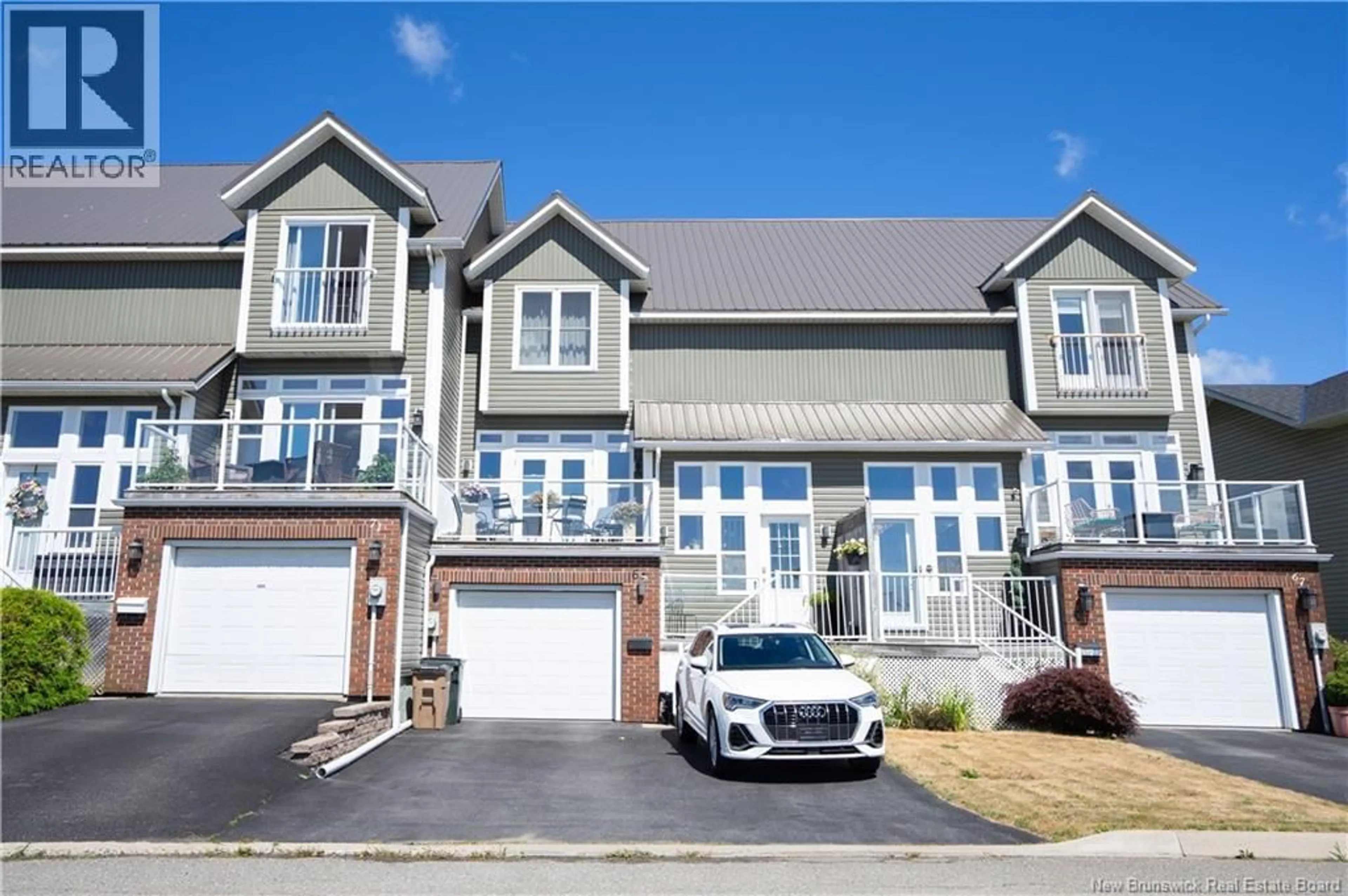 Home with vinyl exterior material, street for 69 MOORE STREET, Saint John New Brunswick E2K5N1